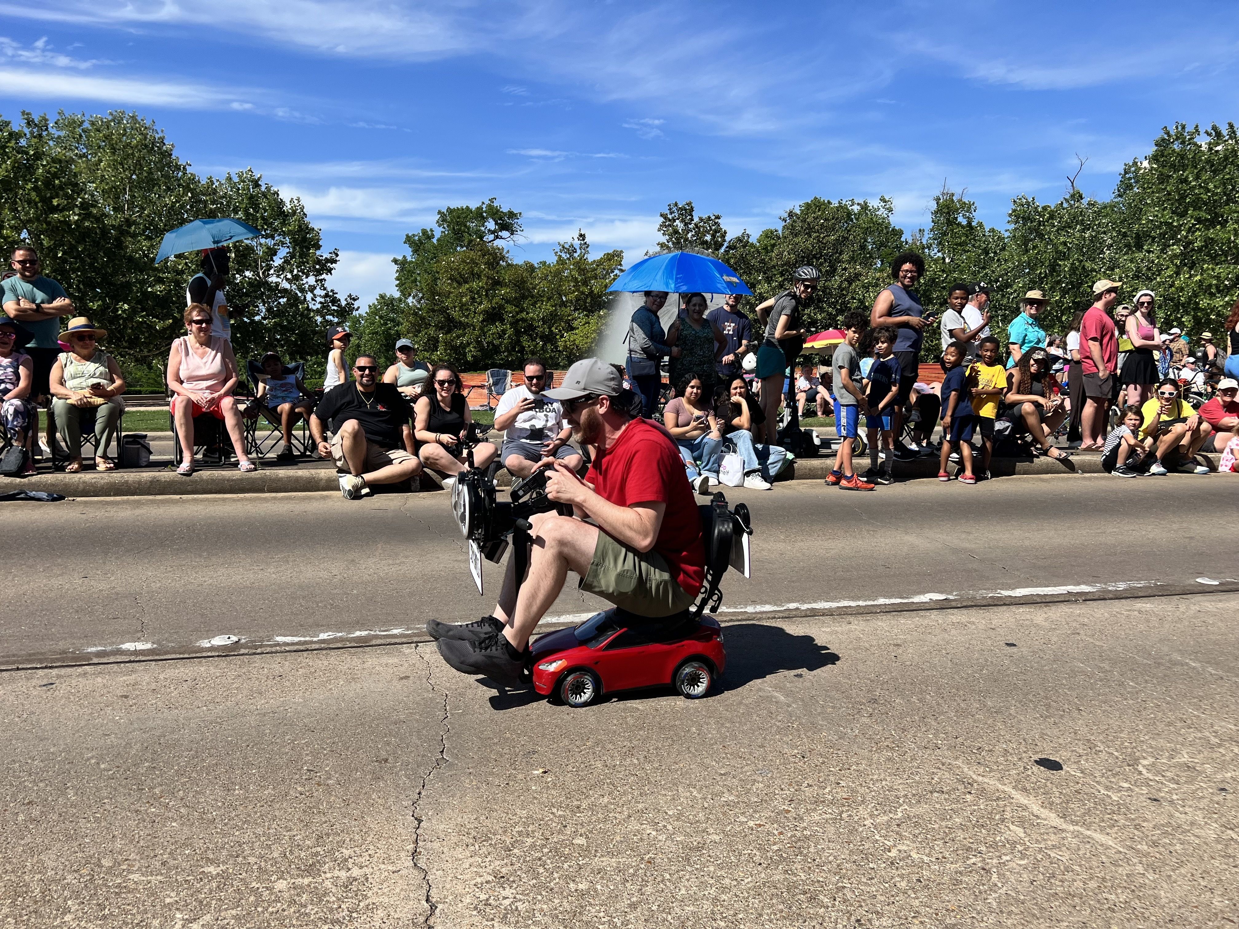 Photo of a man on a toy car