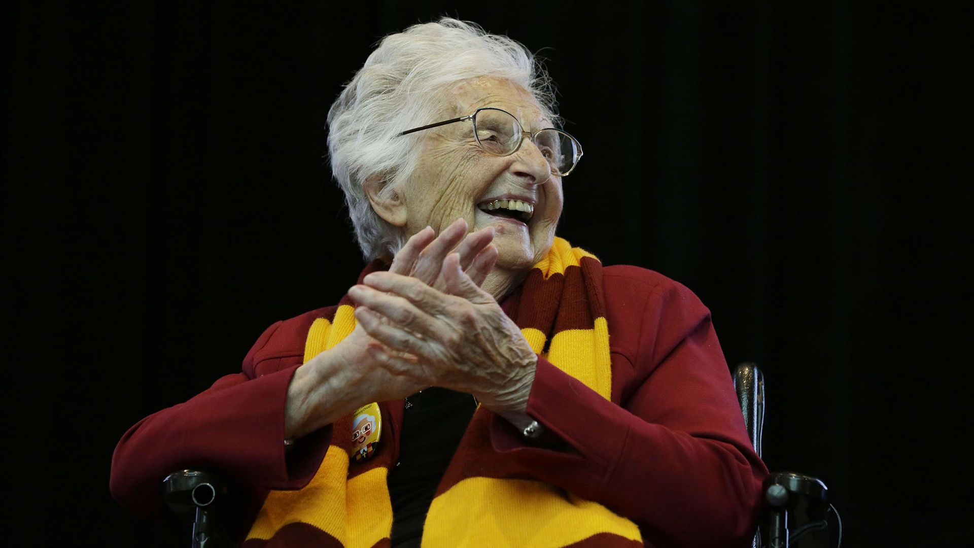 Loyola Chicago basketball super fan Sister Jean claps her hands.