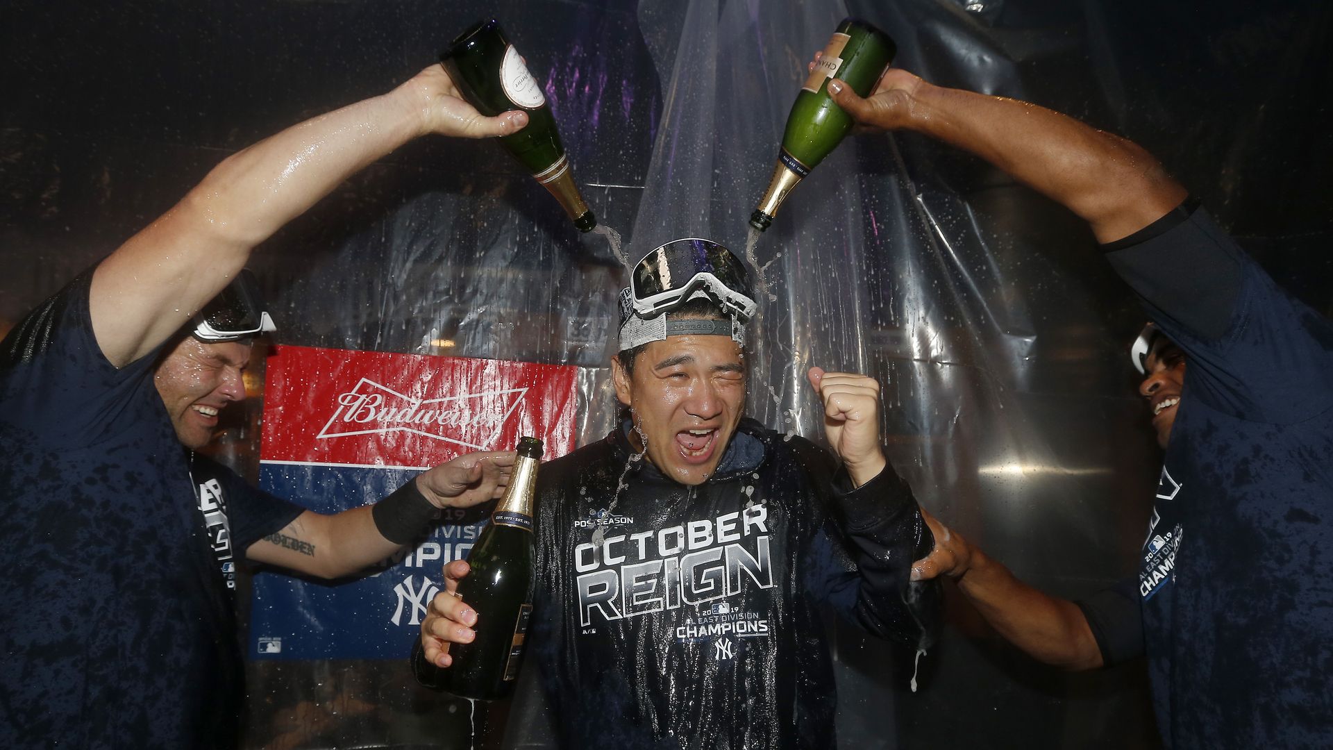 Masahiro Tanaka getting doused with champagne
