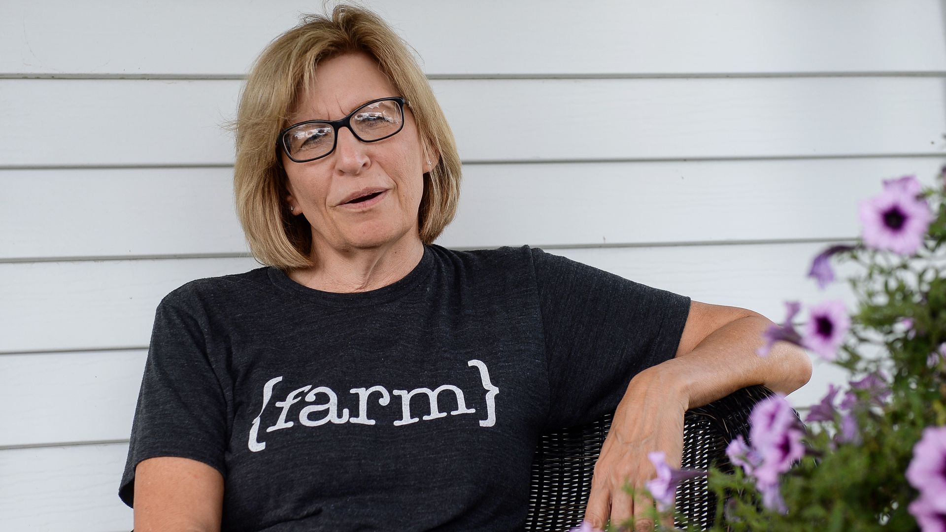 Rita Hart wears a shirt that says "farm" 