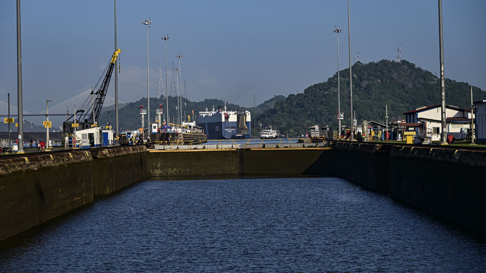 Photo of a large boat moving through locks with low water levels in the Panama Canal.