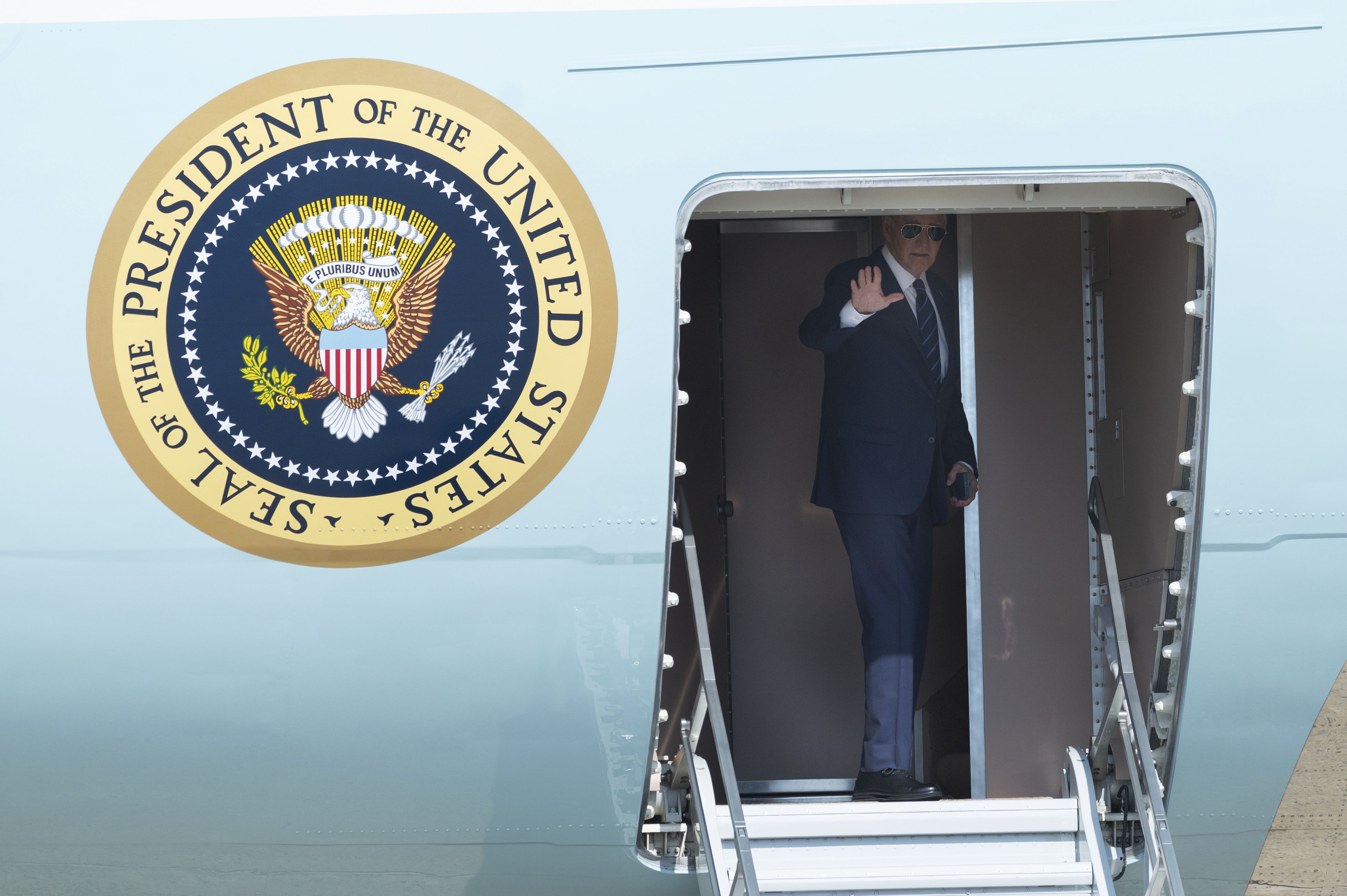 President Biden waves as he boards Air Force One to travel to Las Vegas yesterday.