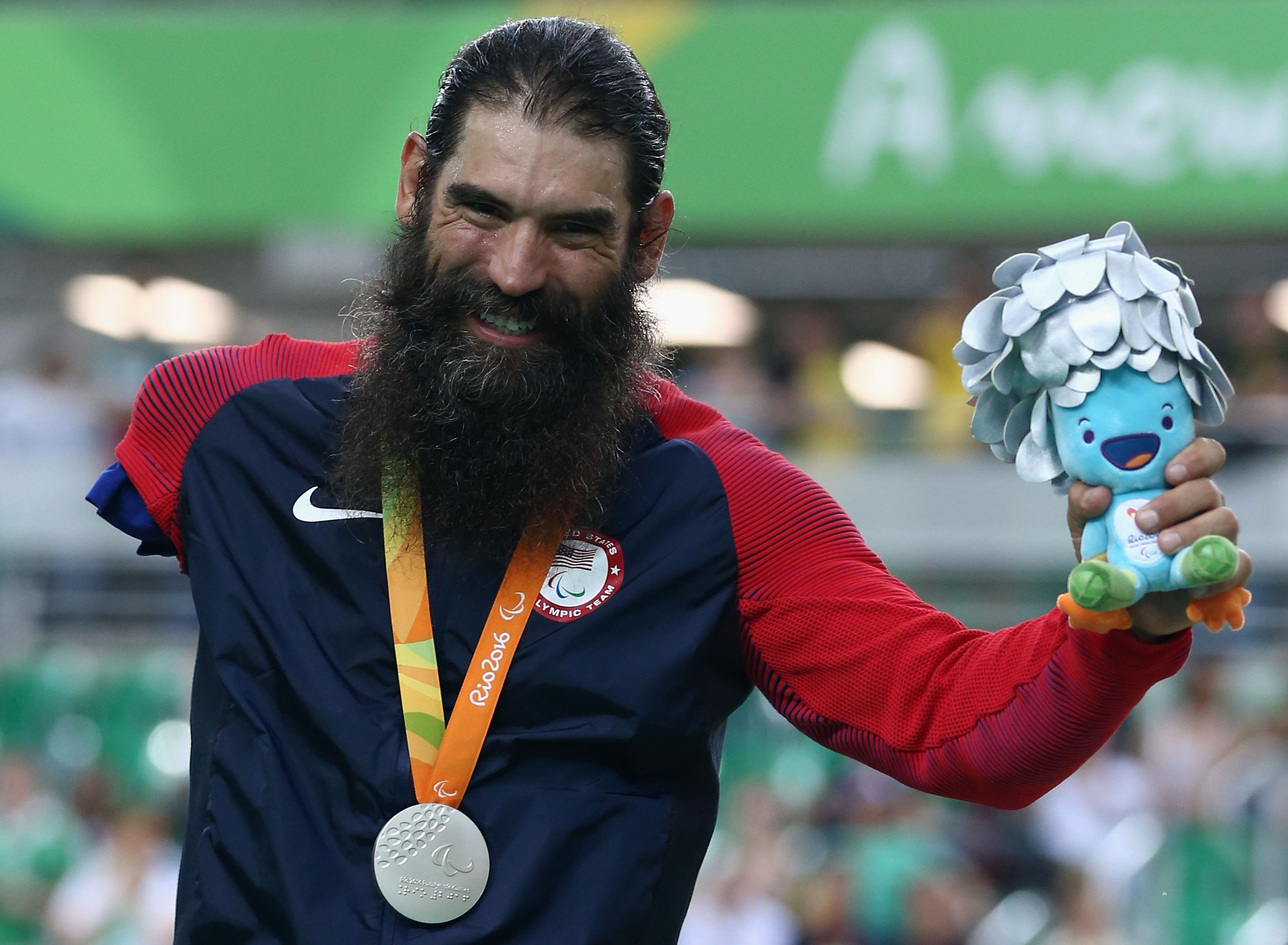 Silver medalist Joe Berenyi of the United States celebrates on the podium at the medal ceremony for Men's 3km Pursuit C3 Final on day 2 of the Rio 2016