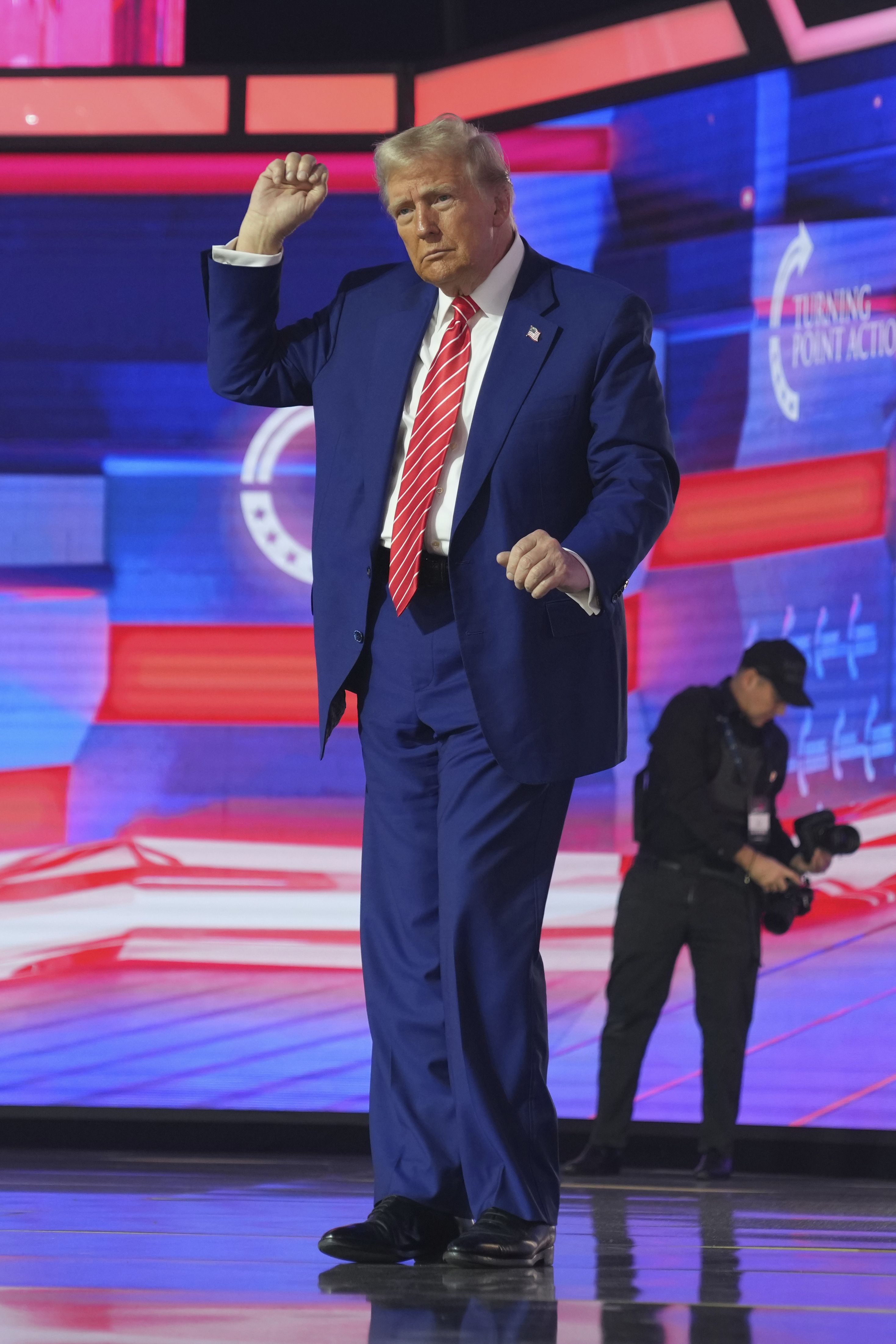 President-elect Donald Trump speaks at AmericaFest, Sunday, Dec. 22, 2024, in Phoenix.