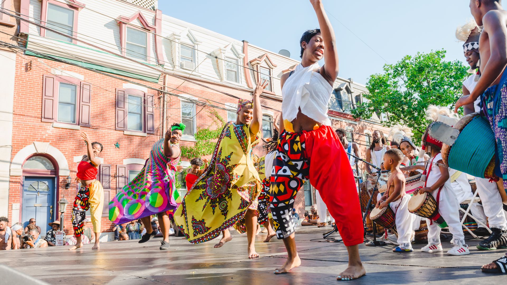 Dancers dancing in the street during the Odunde Festival