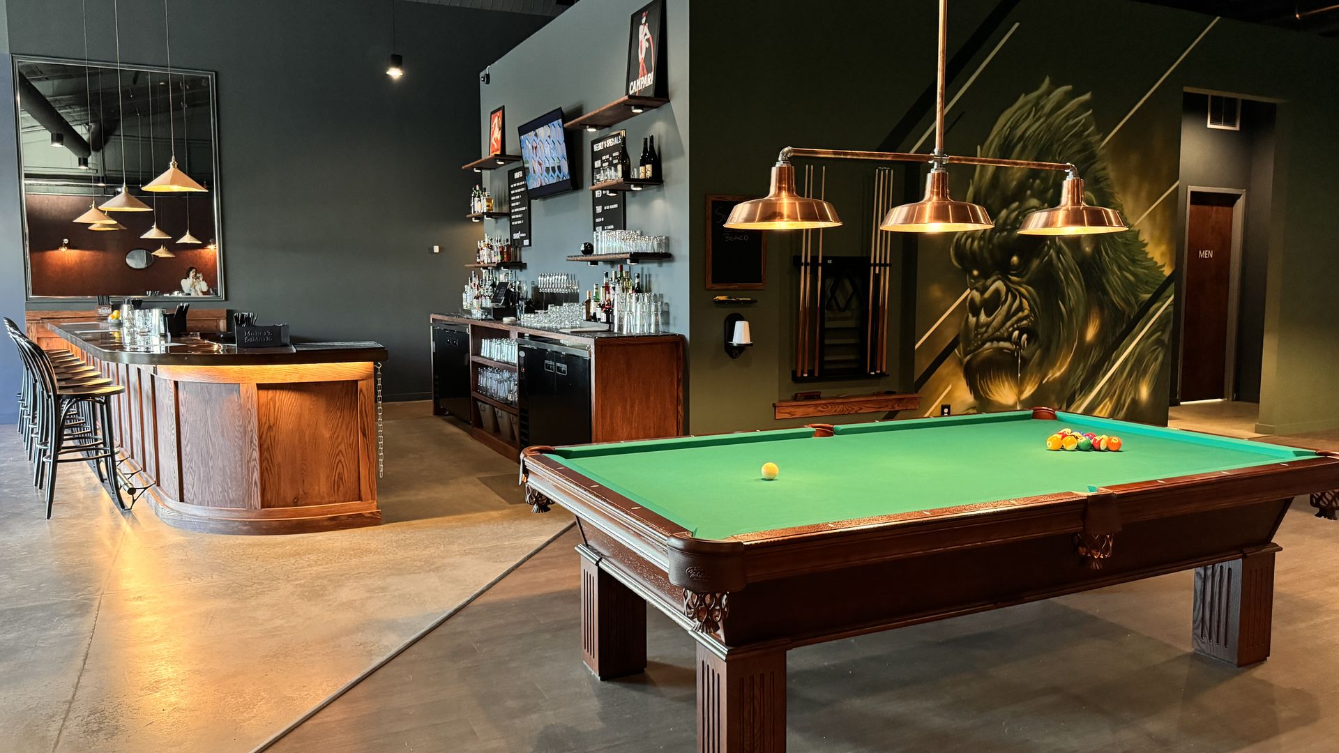 inside pool hall with bar and pool table