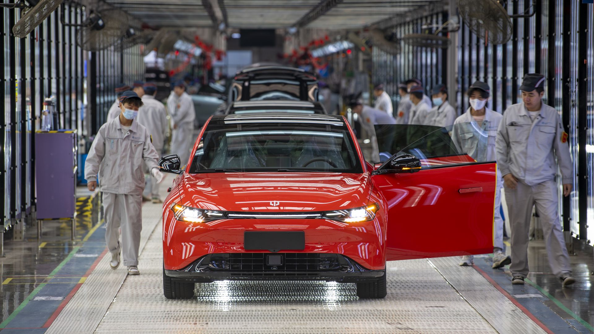 Employees on a Chinese EV startup assembly line in Zhejiang province last October