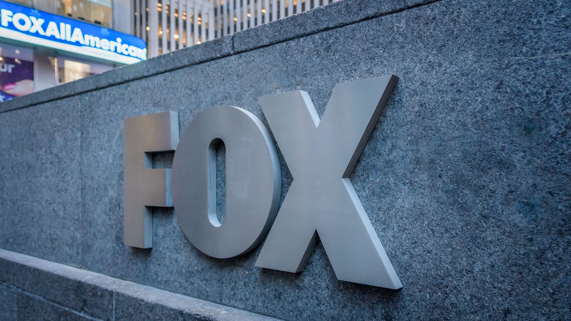 FOX logo outside the News Corporation Building at 1211 Sixth Avenue, Fox News Headquarters in NYC.