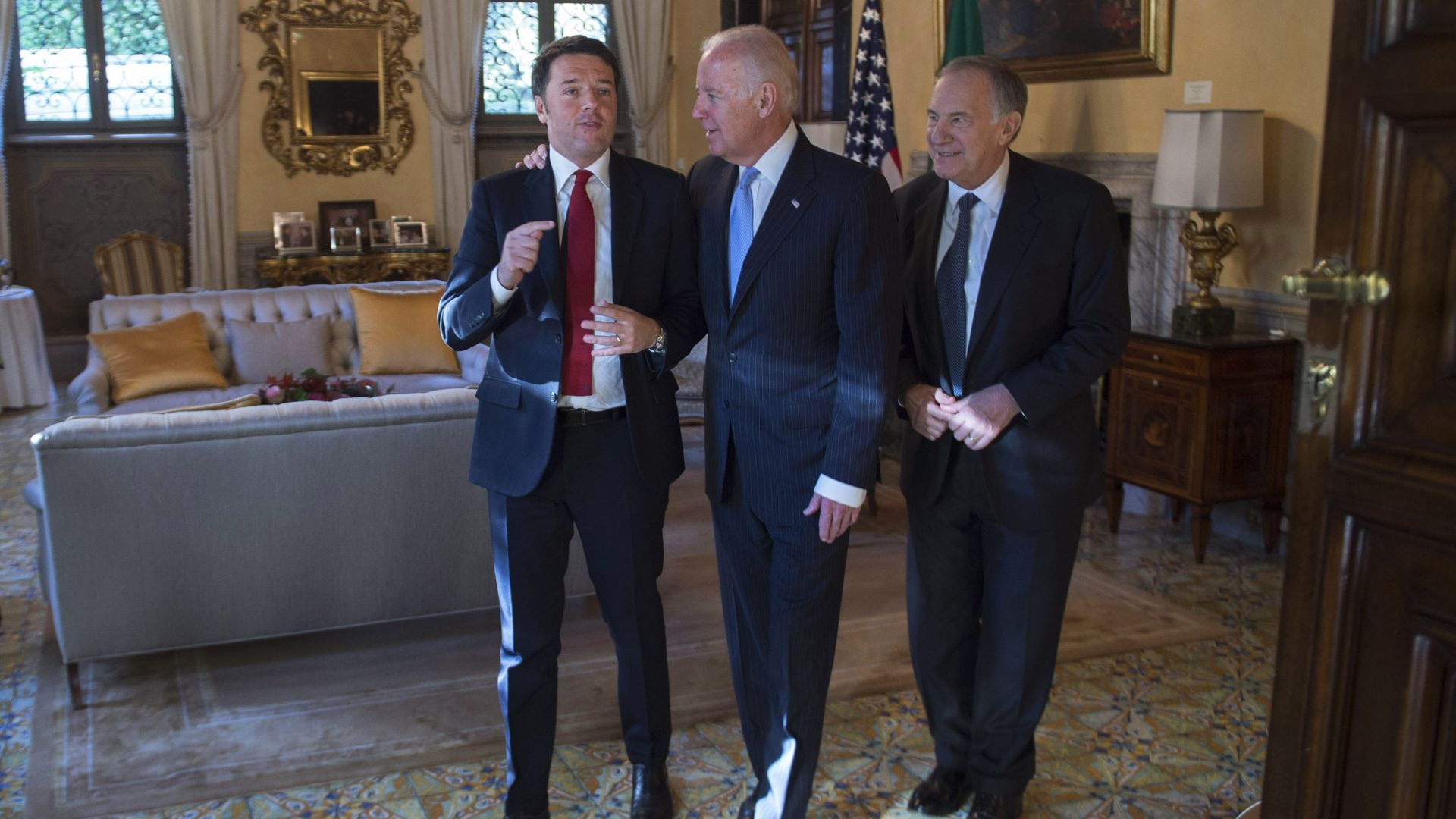 Then-Vice President Joe Biden is seen walking with Italian Prime Minister Matteo Renzi and U.S. Ambassador to Italy John Phillips in 2015.