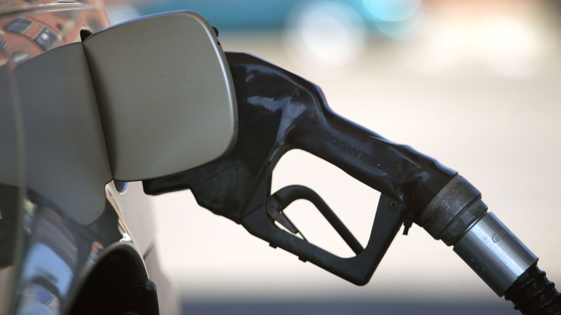 Photo of pumping gas at a gas station. 