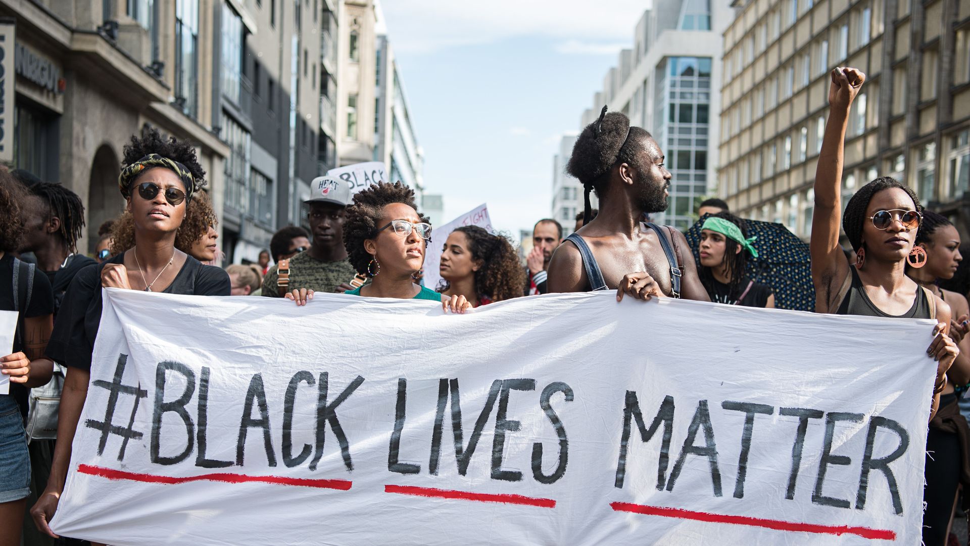Demonstrators held a banner with the motto of the black civil rights movement with the twitter hashtag "Black Lives Matter" to show their solidarity worldwide with African Americans in the US in Berlin, Germany, 10 July 2016.