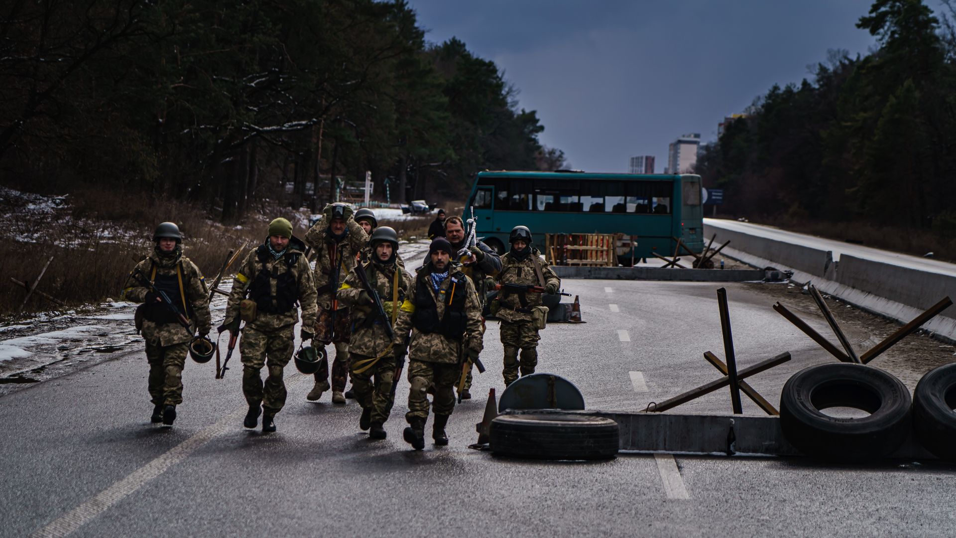 Soldiers arrive to reinforce one of the final checkpoints before the frontlines where Ukrainian forces are battling invading Russian forces near Brovary, Ukraine, Tuesday, March 8, 2022.