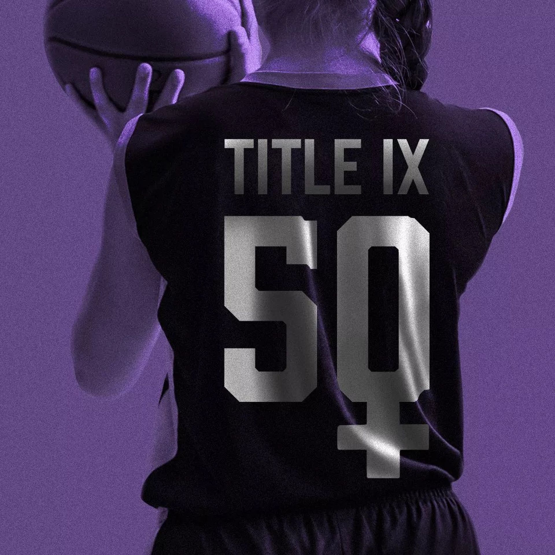 A basketball player with "title ix" on their jersey