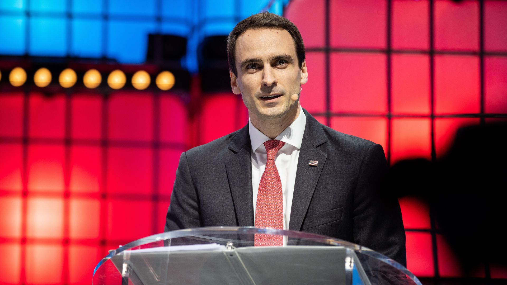 White House Chief Technology Officer Michael Kratsios speaks at a lectern during a technology industry conference.