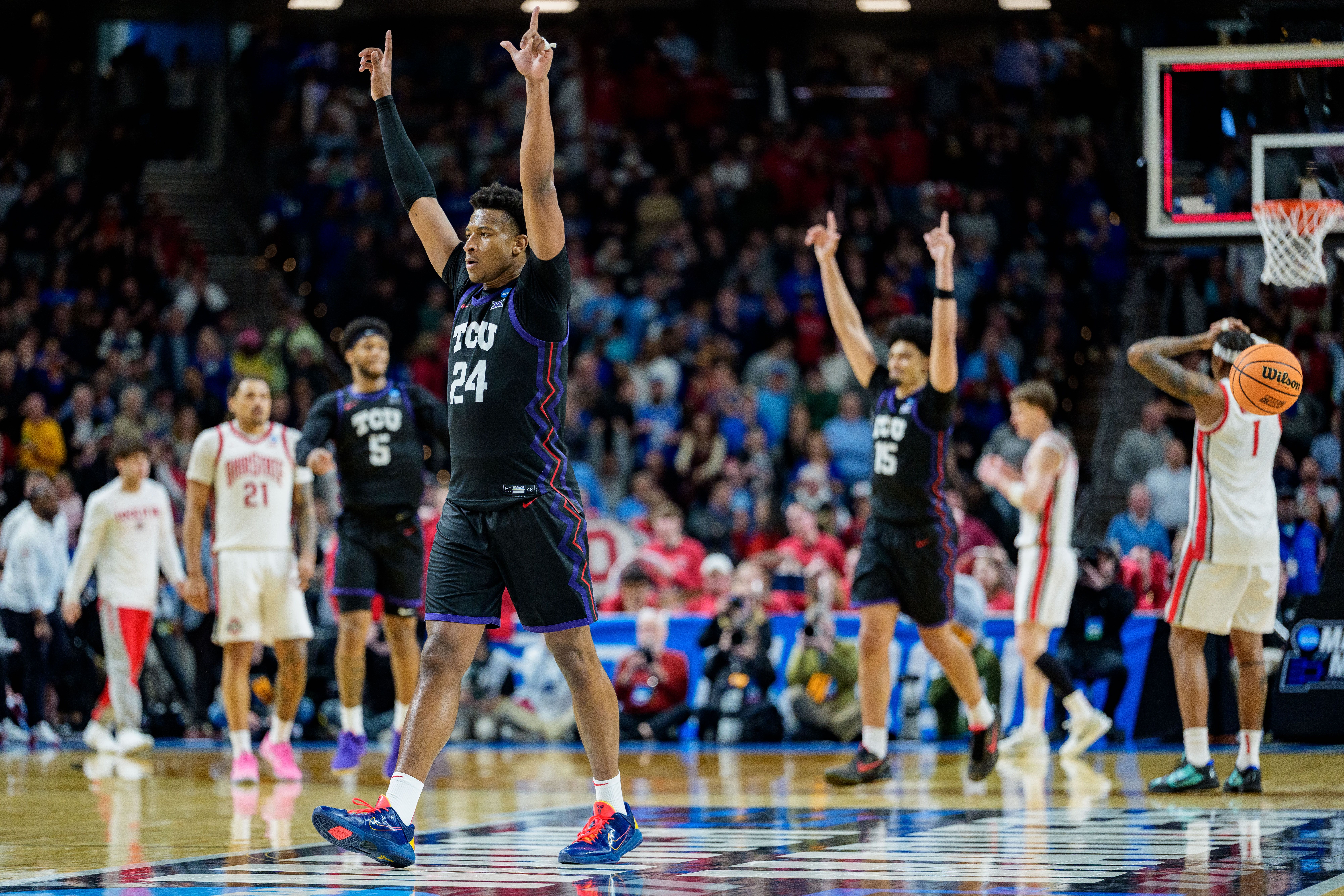Xavier Edmonds #24 of the TCU Horned Frogs celebrates after defeating the Ohio State Buckeyes