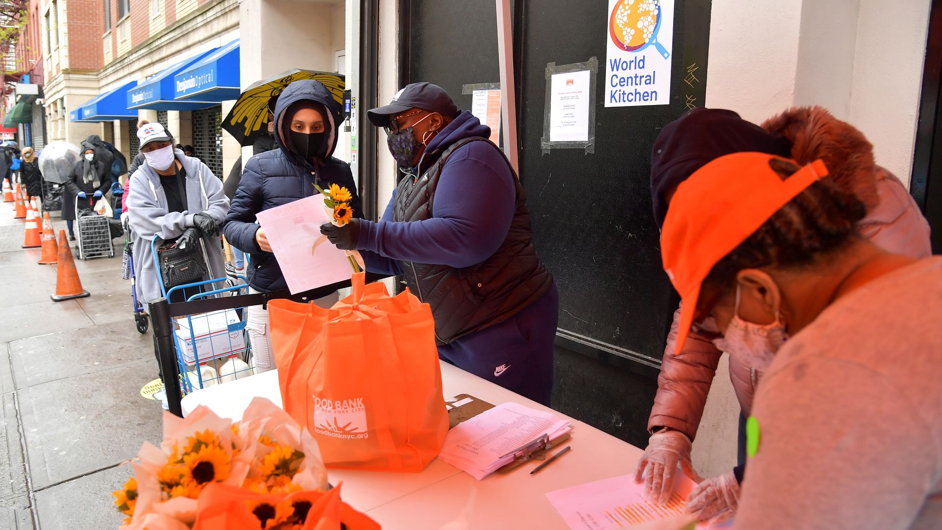 People line up A volunteer distributes childcare essentials to families in need for Mother's Day at Food Bank For New York City’s Community Kitchen & Food Pantry.