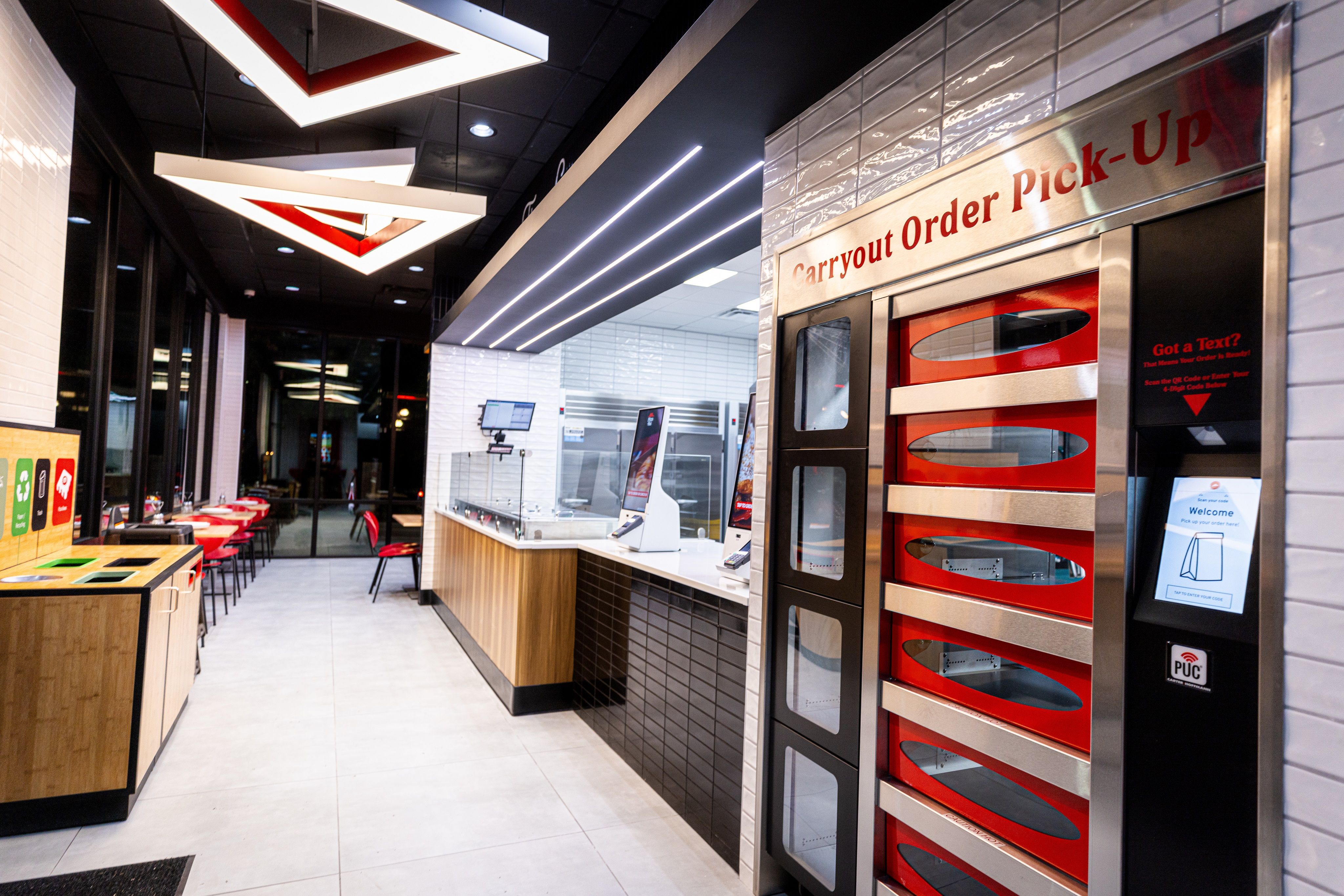 The interior of a fast-food restaurant with heated pickup shelves