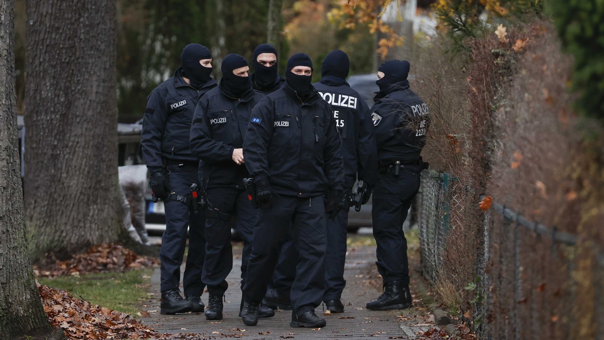 Police officers work during a raid in Berlin, Germany, on December 07, 