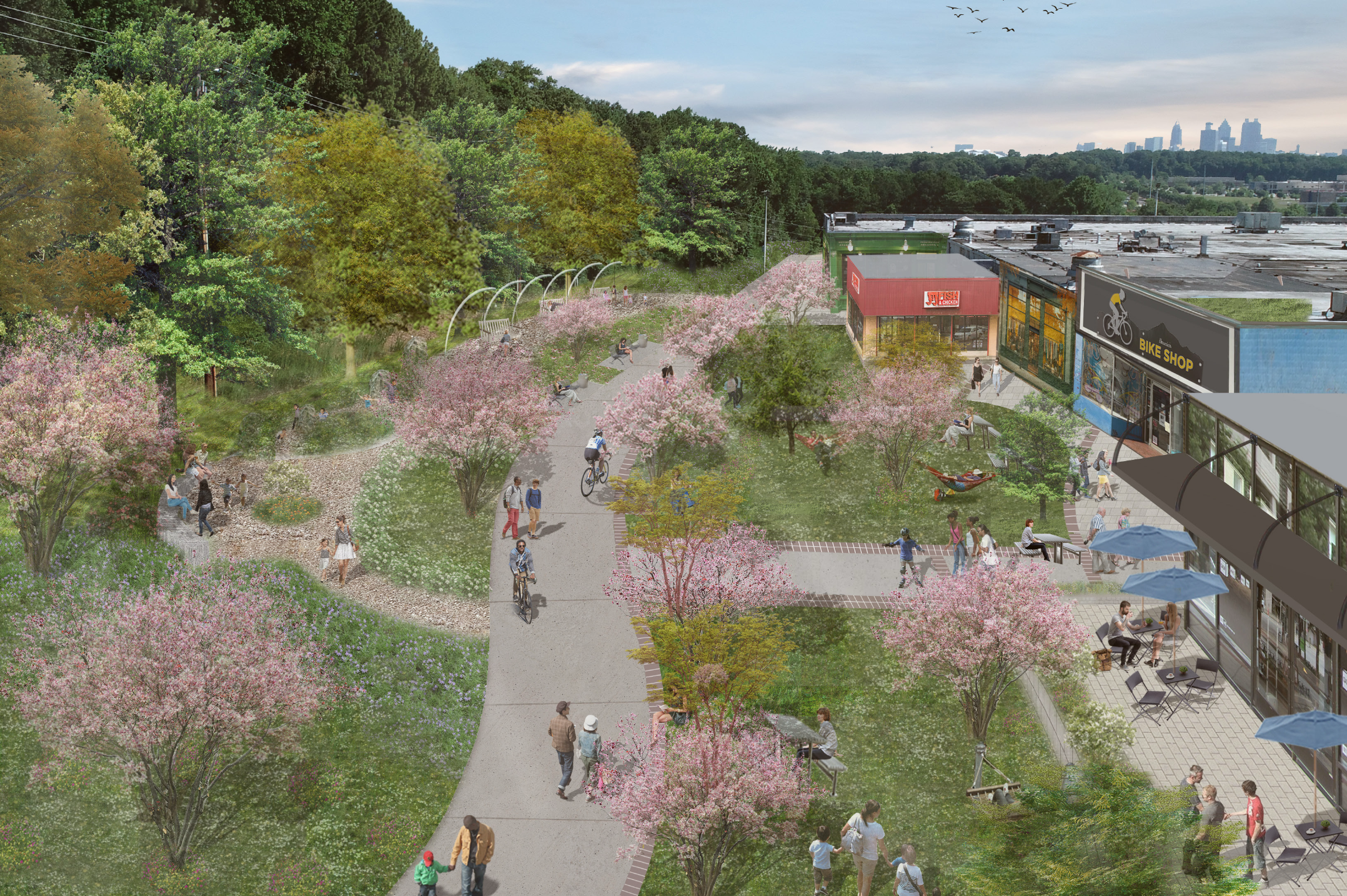 A rendering of a bike lane running alongside a large building with seating and shops and the Atlanta skyline in the background