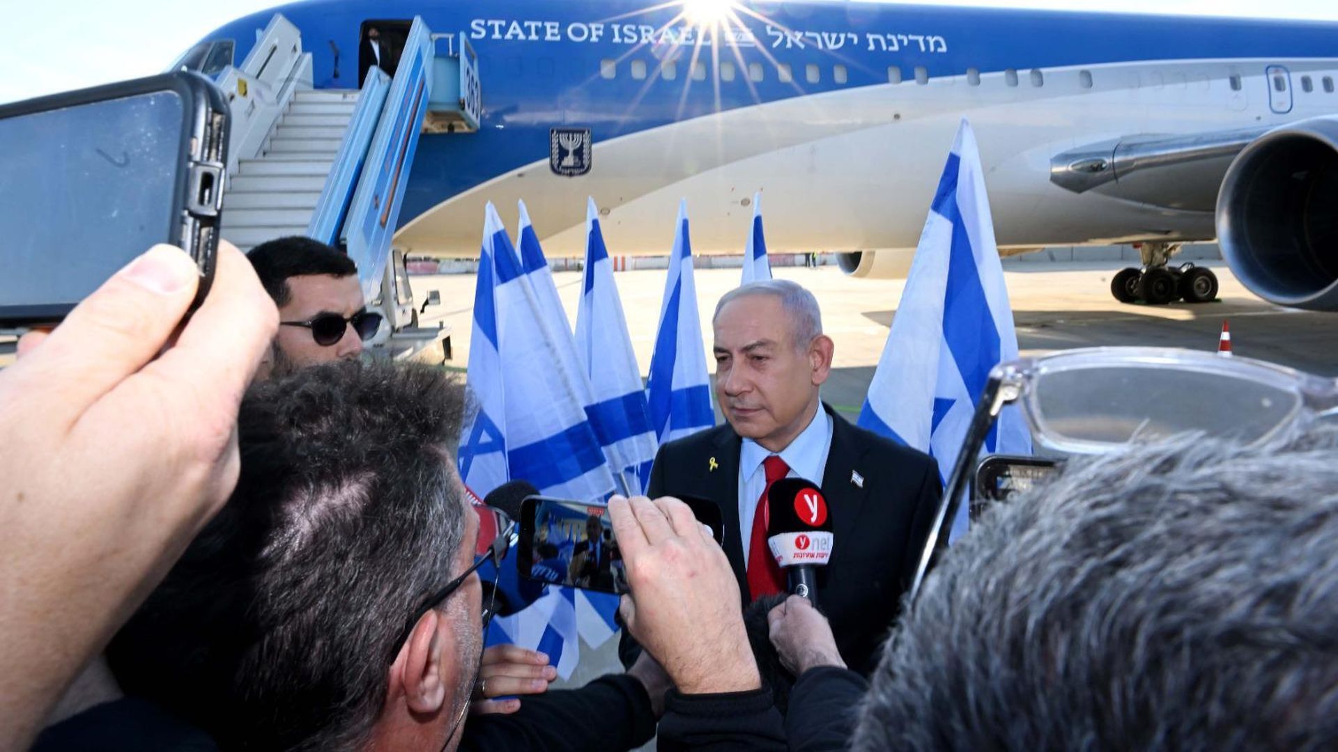 Israeli Prime Minister Benjamin Netanyahu speaks to reporters before departing for the U.S. on Sunday.