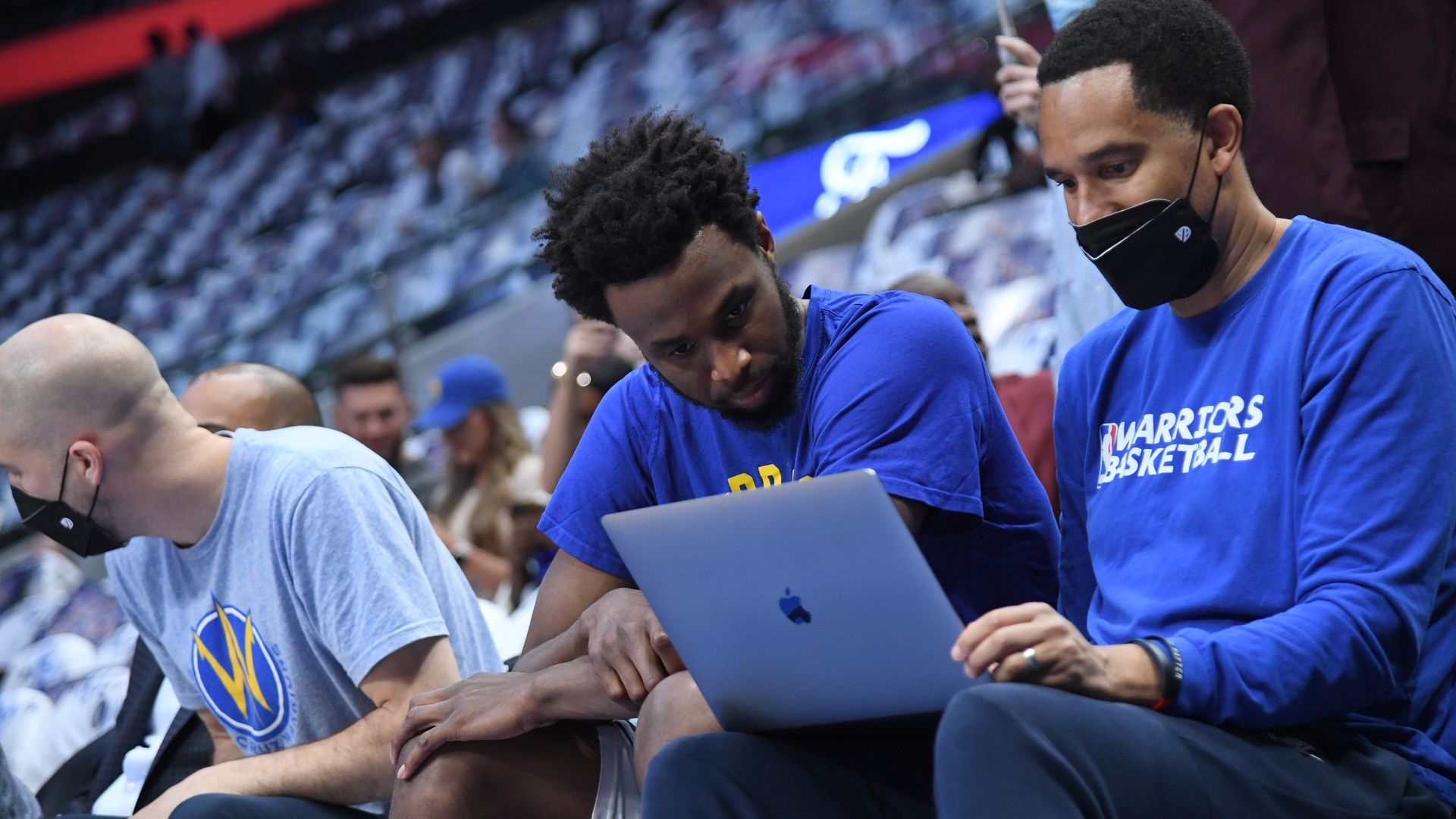 Warriors Assistant Coach Jama Mahlalela talks with Andrew Wiggins prior to a playoff game against the Dallas Mavericks.