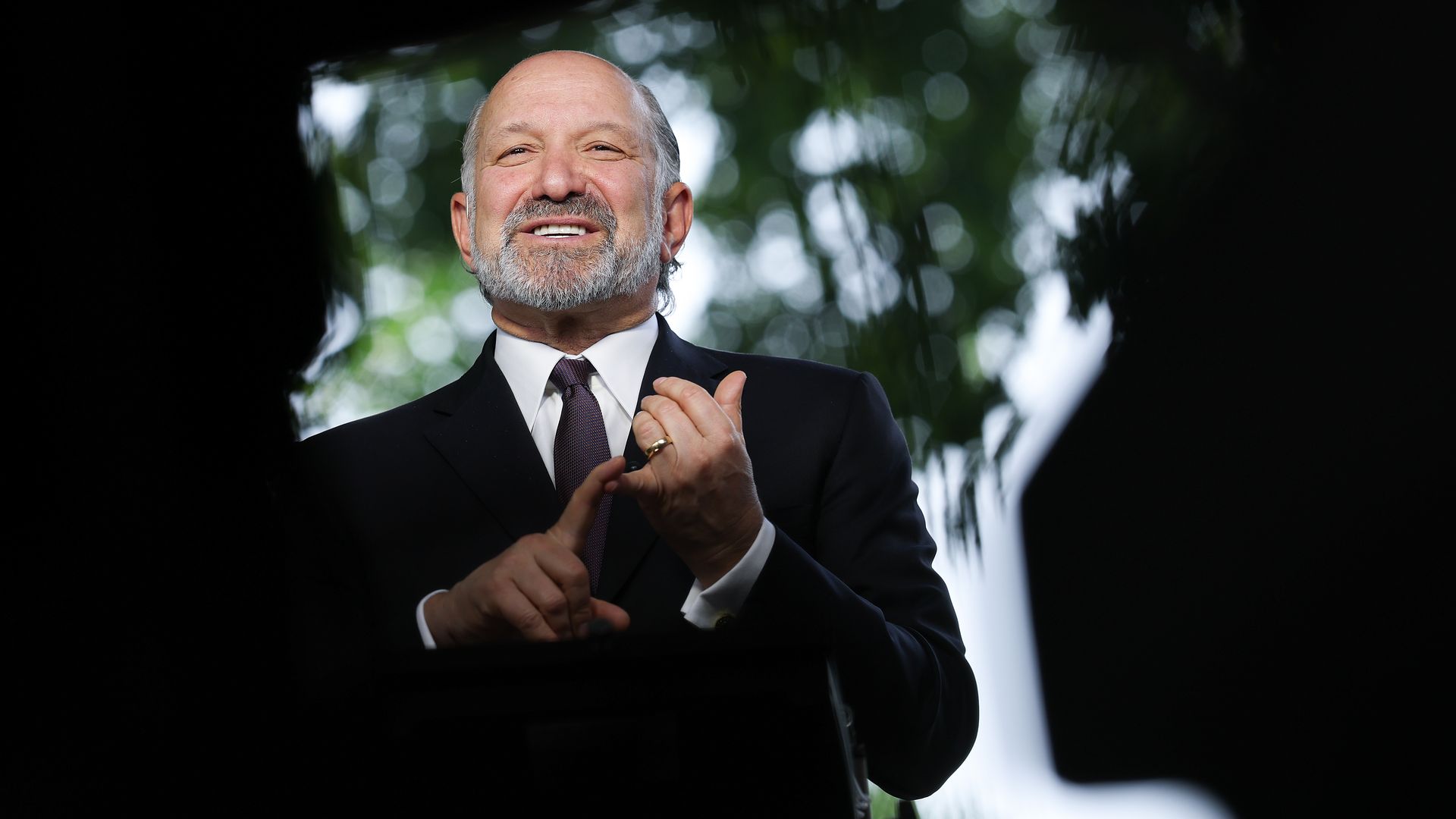 Commerce Secretary Howard Lutnick standing outside the White House, speaking to reporters. 