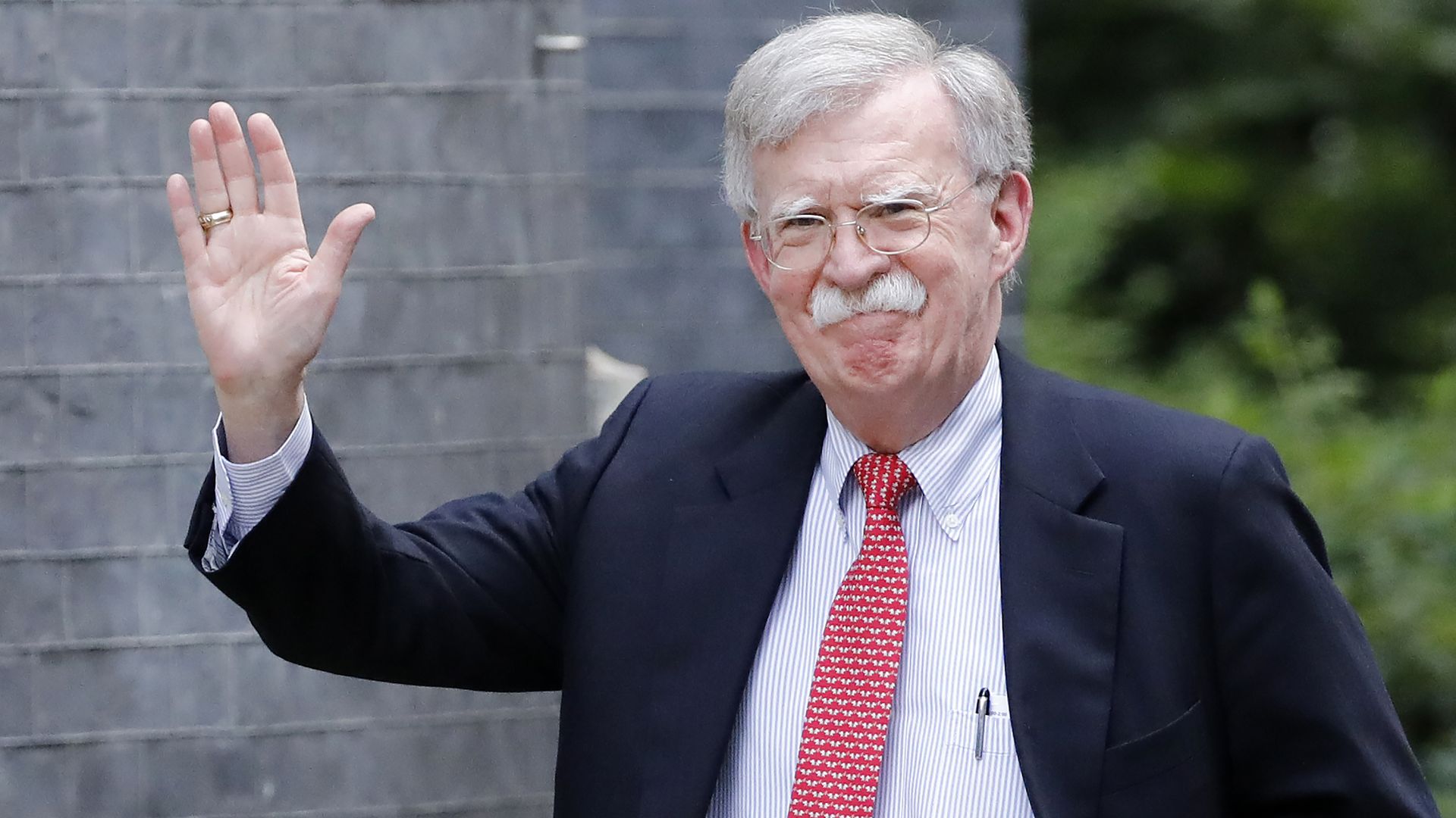 John Bolton arrives in Downing Street in London, Aug. 13.