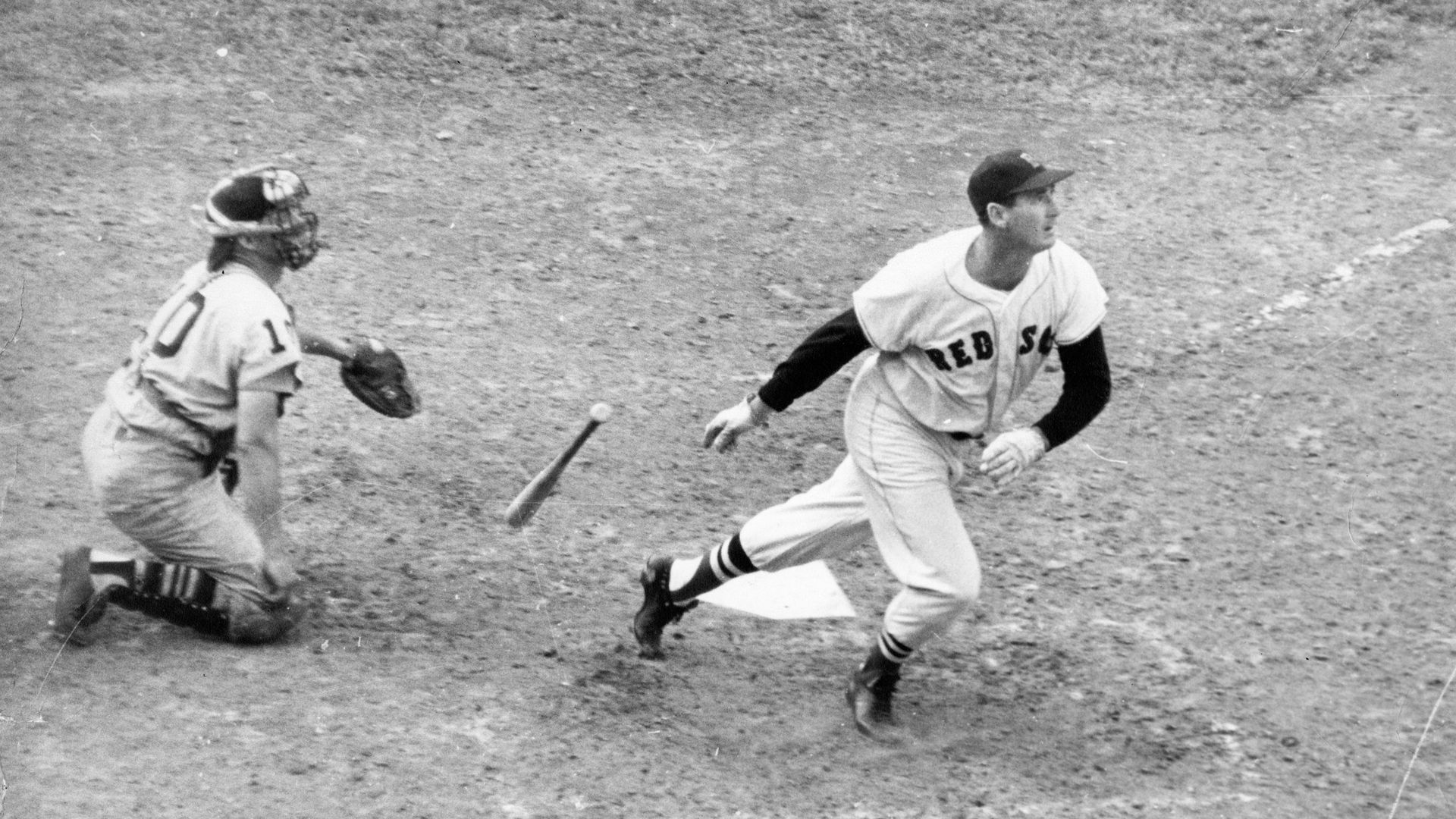 Boston Red Sox sluggerTed Williams watches his hit at Fenway Park in Boston during the 1959 season.