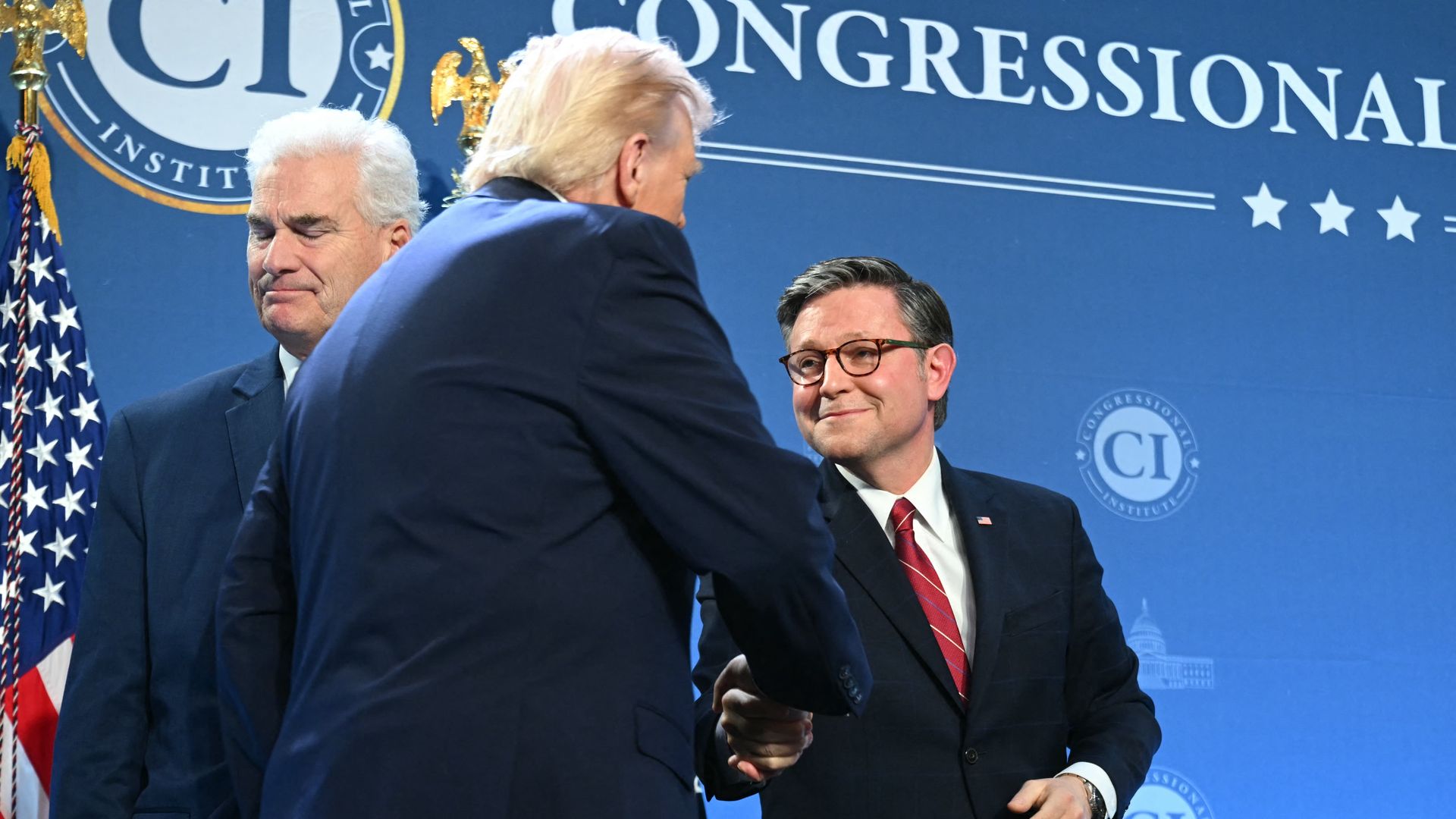 President Trump greets House Speaker Mike Johnson and Majority Whip Tom Emmer during House Republicans' retreat at Trump National Doral in Miami on March 9. 