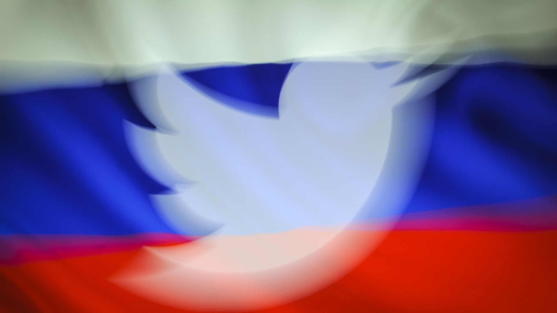 Twitter logo in front of Russian flag