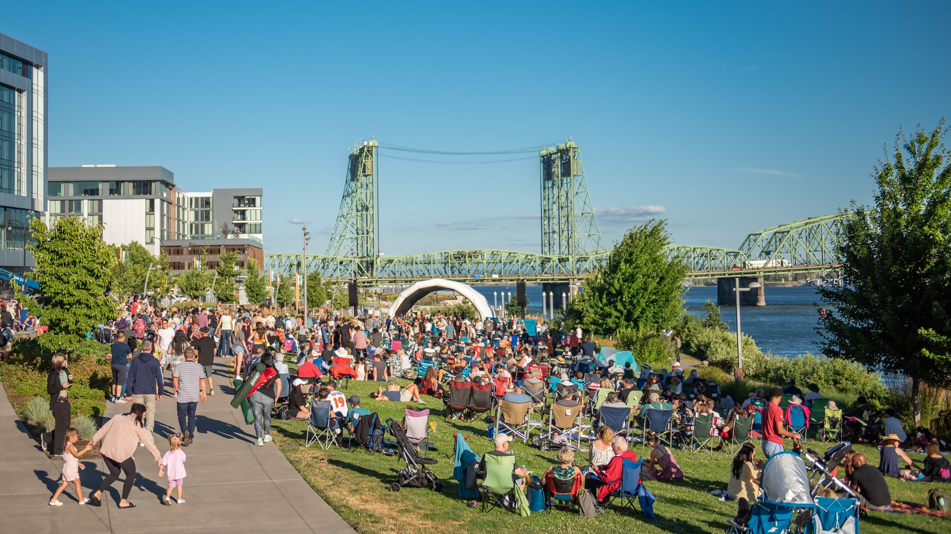 A photo of people gathered along a waterfront.