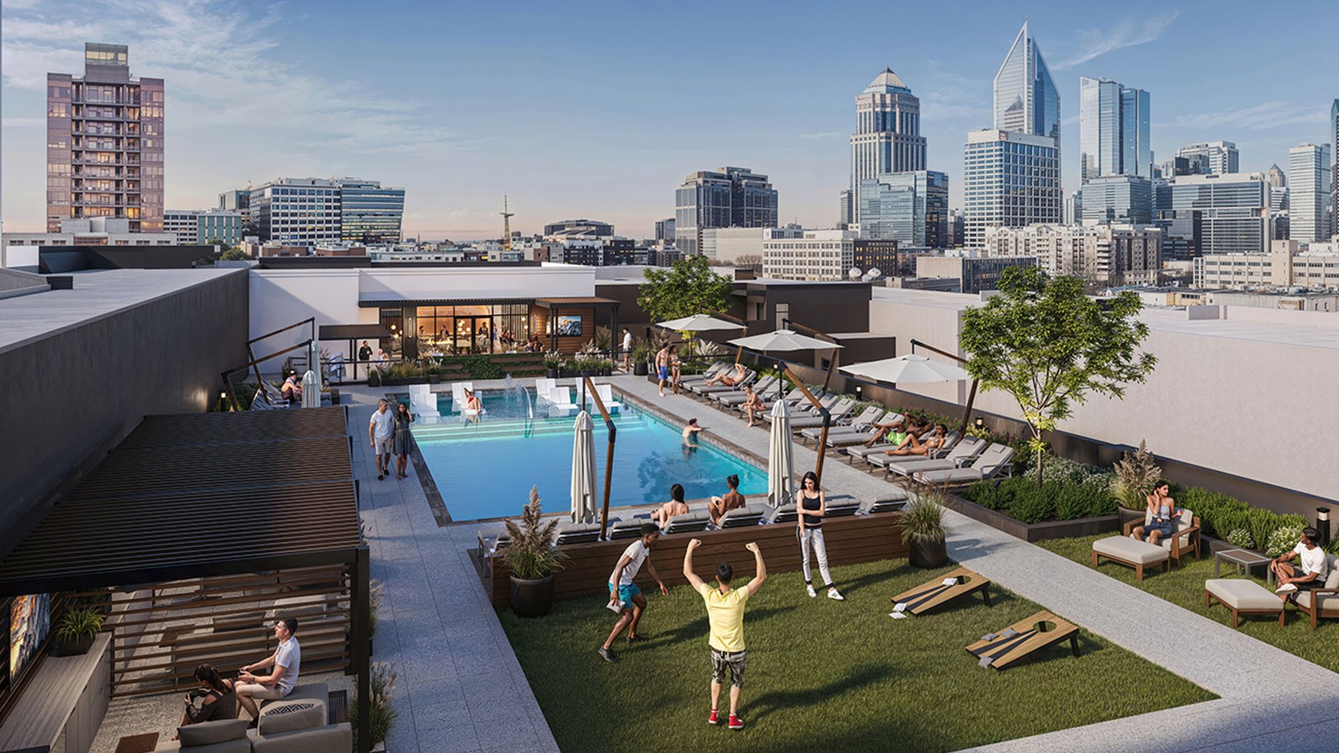 Rooftop pool area of a modern building, city skyline in the background; people swim and lounge by the pool, while others relax on couches and grass with umbrellas and sun loungers.
