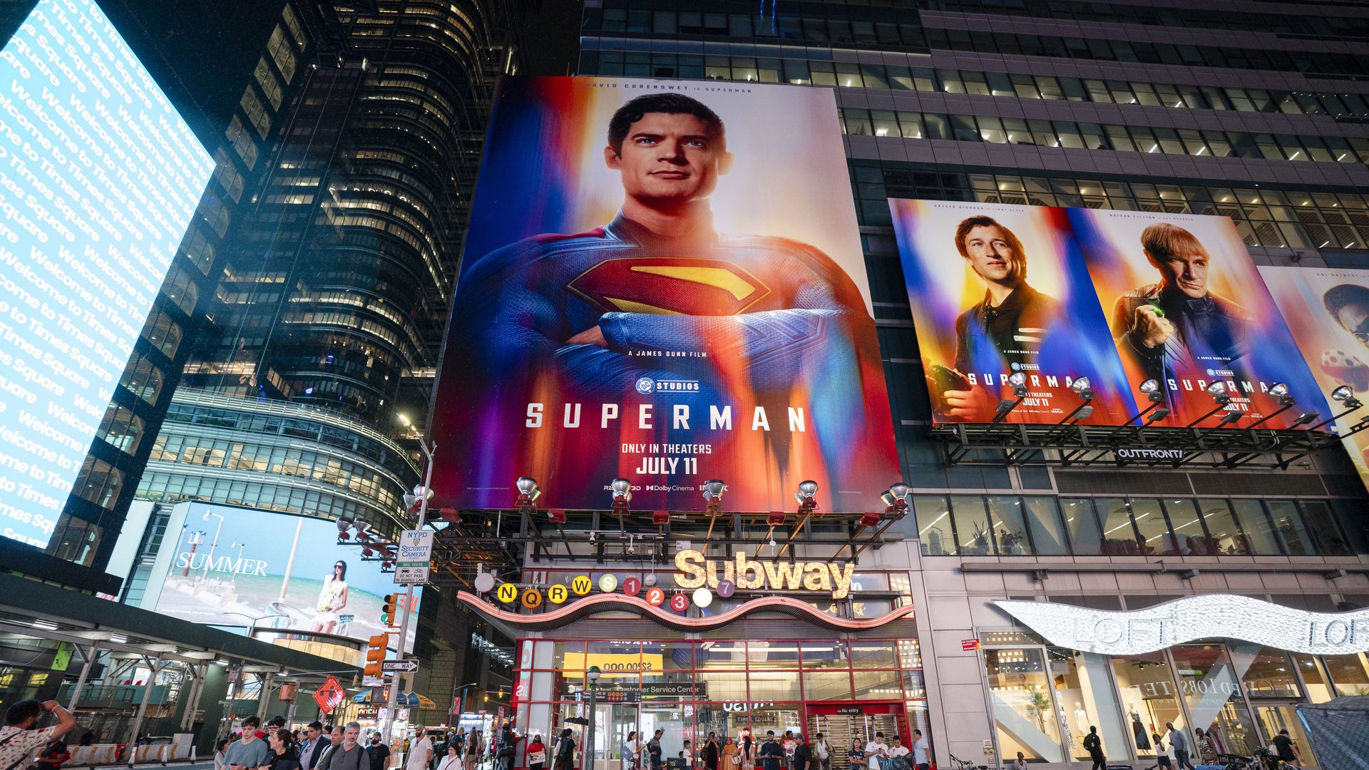 NEW YORK, NEW YORK - JULY 09: People cross the street near billboards advertising the new "Superman" film in Times Square on July 09, 2025 in New York City. (Photo by Craig T Fruchtman/Getty Images)