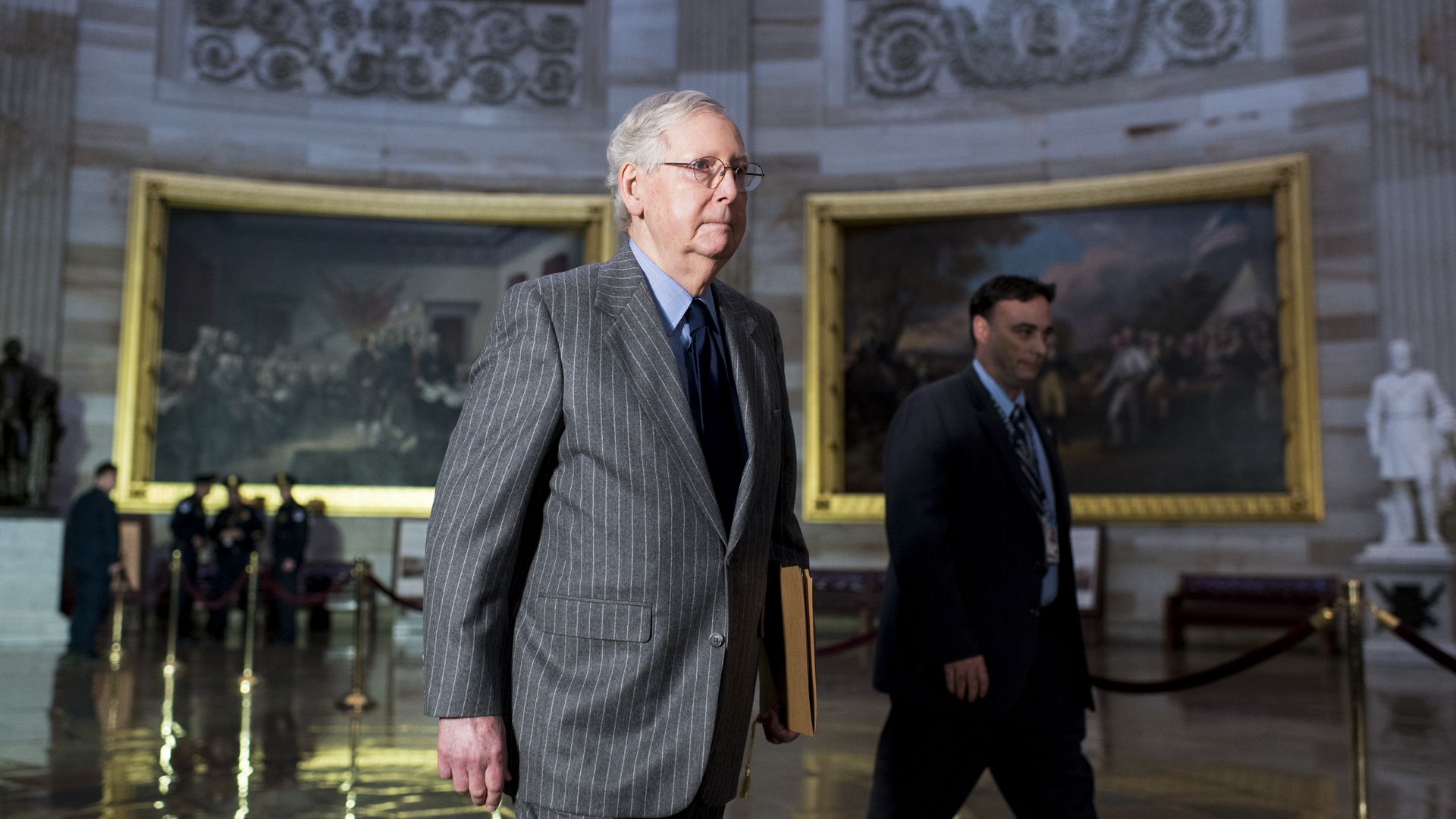 Senate Majority Leader Mitch McConnell, R-Ky., walks back to the Senate through the Rotunda.