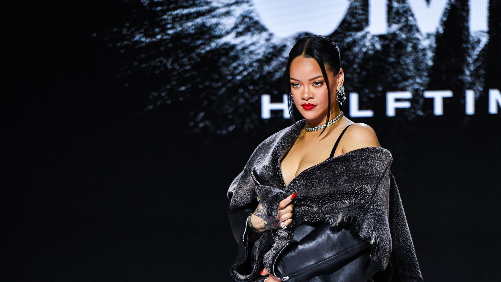 Rihanna poses for photos after the Super Bowl LVII Apple Music Halftime Show press conference held at the Phoenix Convention Center. 