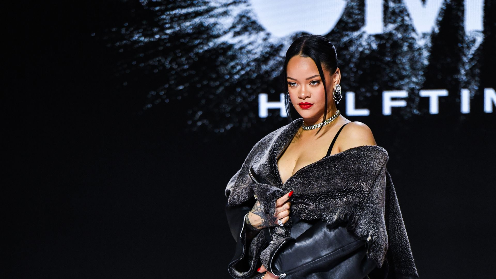 Rihanna poses for photos after the Super Bowl LVII Apple Music Halftime Show press conference held at the Phoenix Convention Center. 