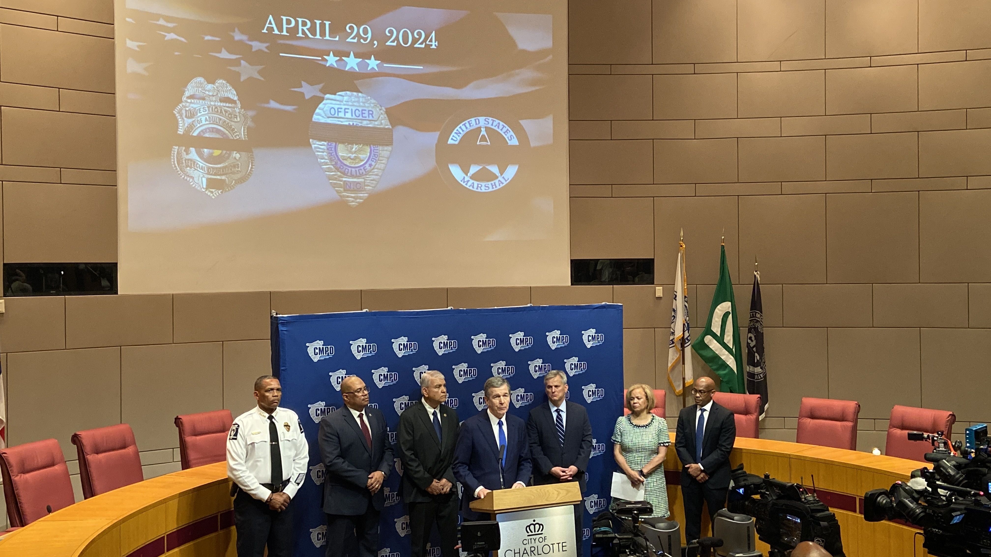 State, local and federal leaders gather in Uptown Charlotte for a press conference followed Monday's mass shooting.
