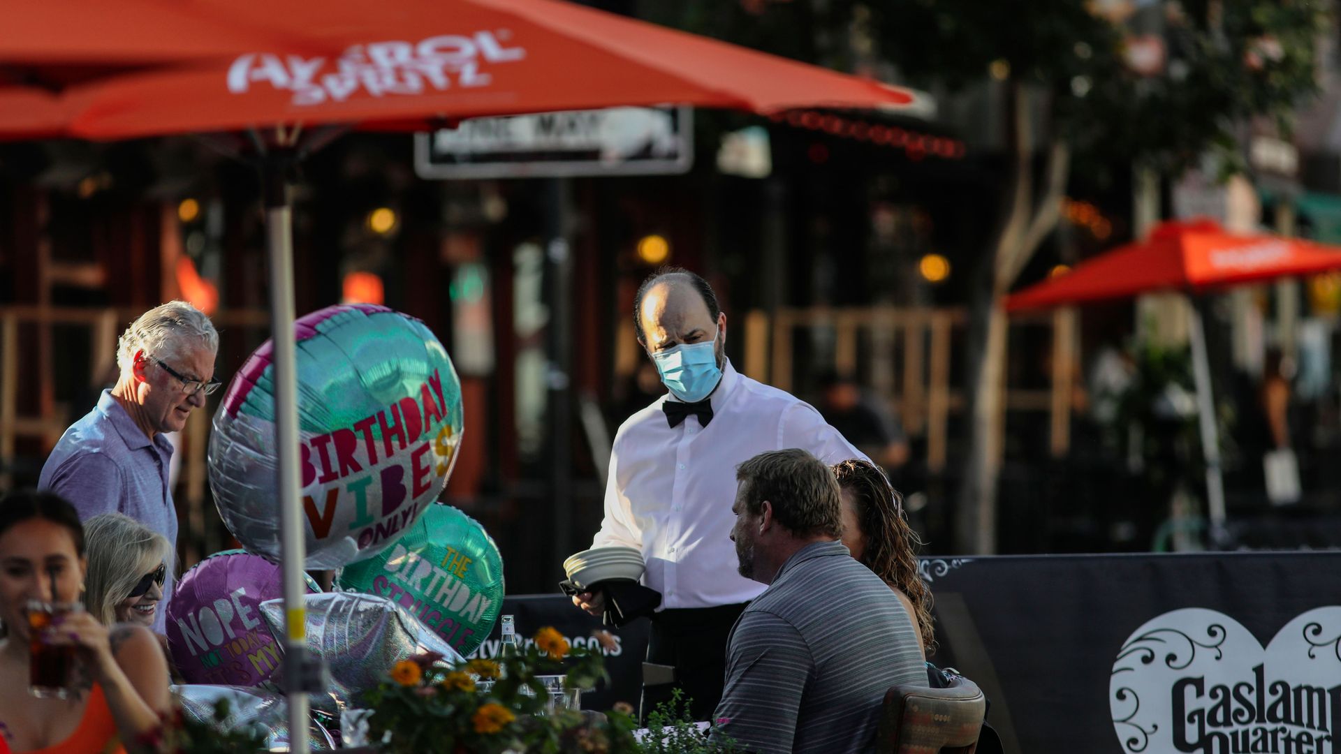 People dine at an outdoor restaurant in New York City on July 17.