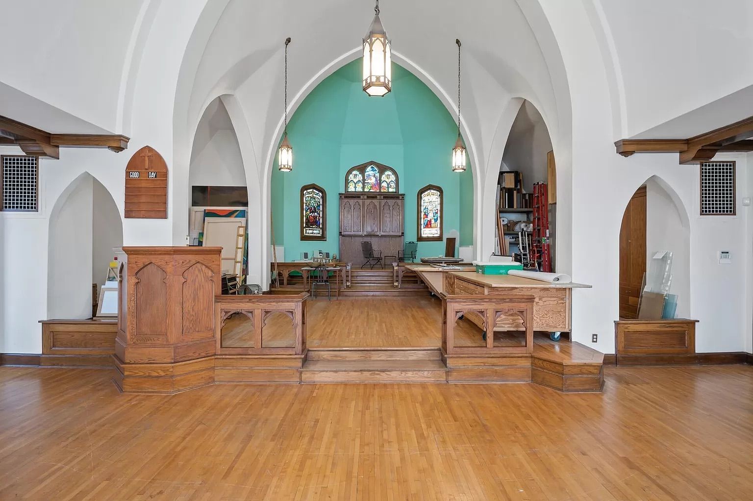 A stage in a church sanctuary with a podium.