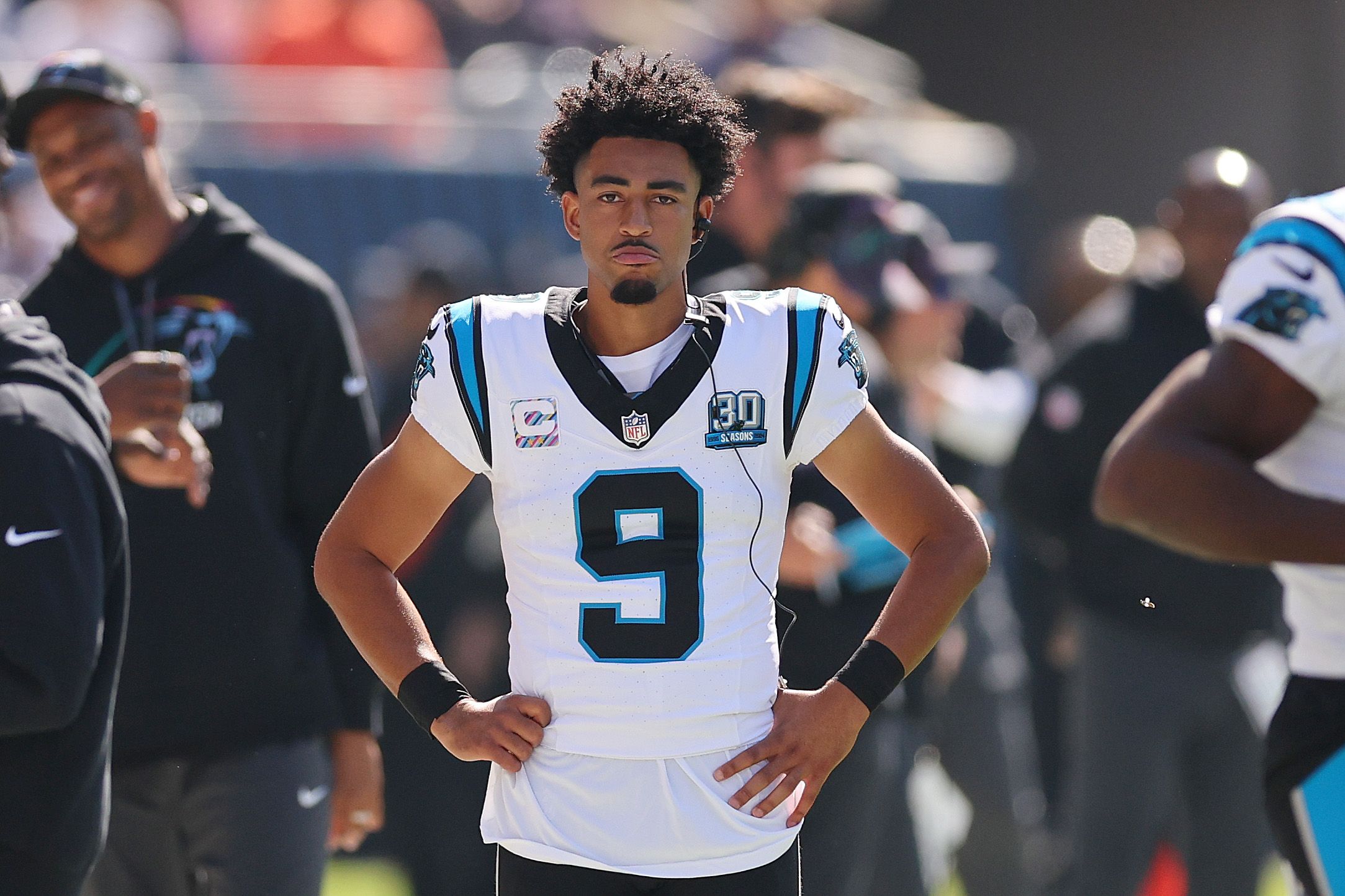 Panthers player Bryce Young with his hands on his hip