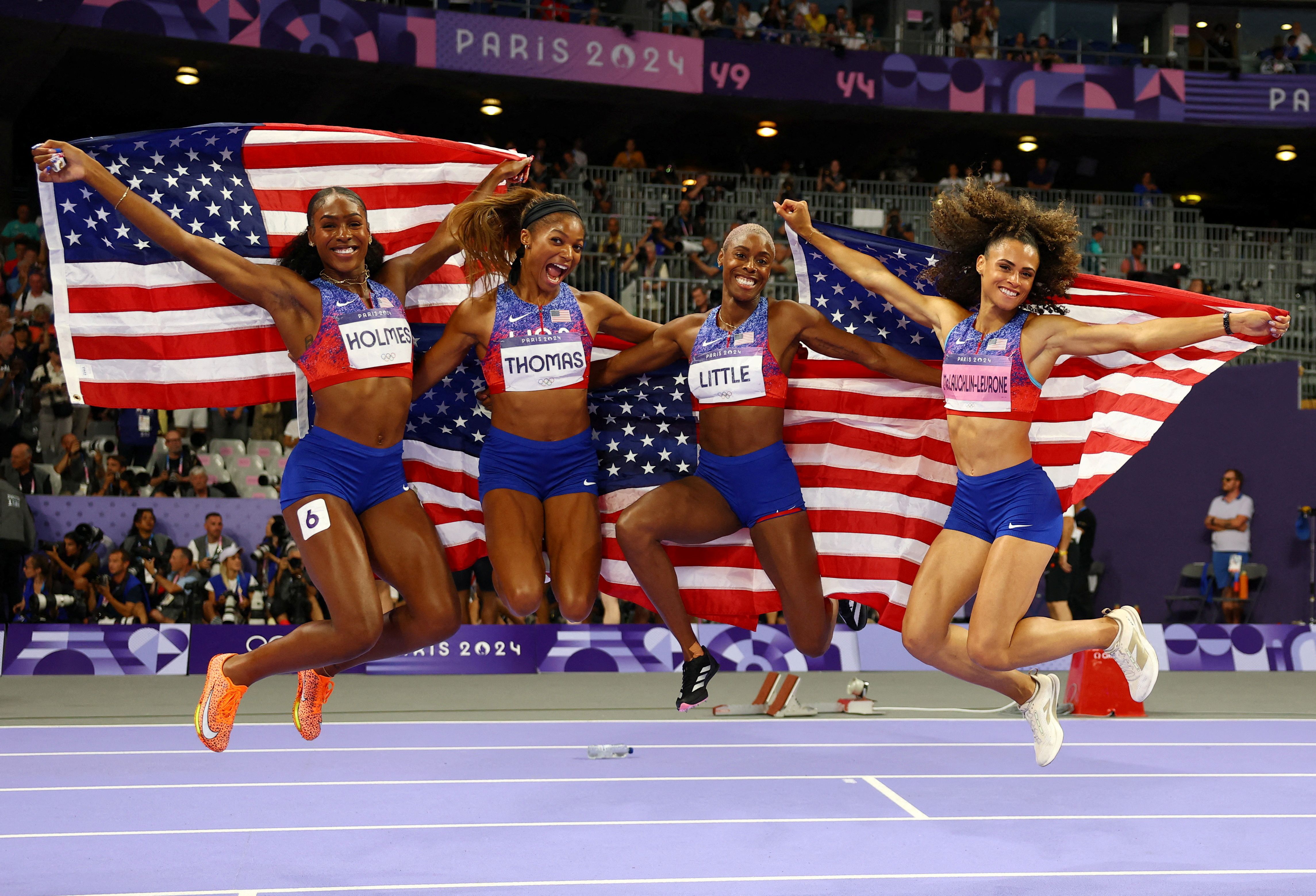 The Team USA womenโs 4x400-meter relay team โ Shamier Little, Sydney McLaughlin-Levrone, Gabrielle Thomas and Alexis Holmes โ celebrates gold in Saint-Denis, France, yesterday.