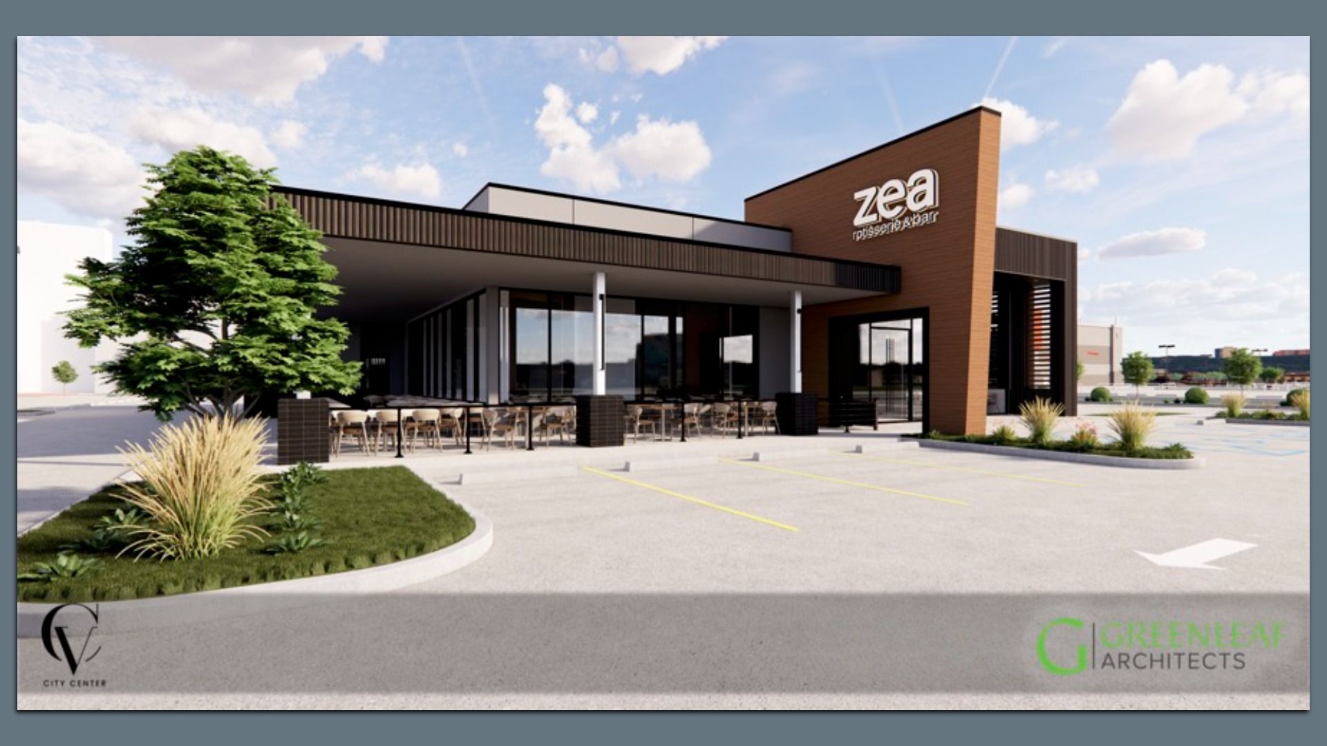 Modern single-story restaurant building with outdoor seating, brown and black exterior, large windows, parking lot in front, green landscaping, and blue sky with clouds.