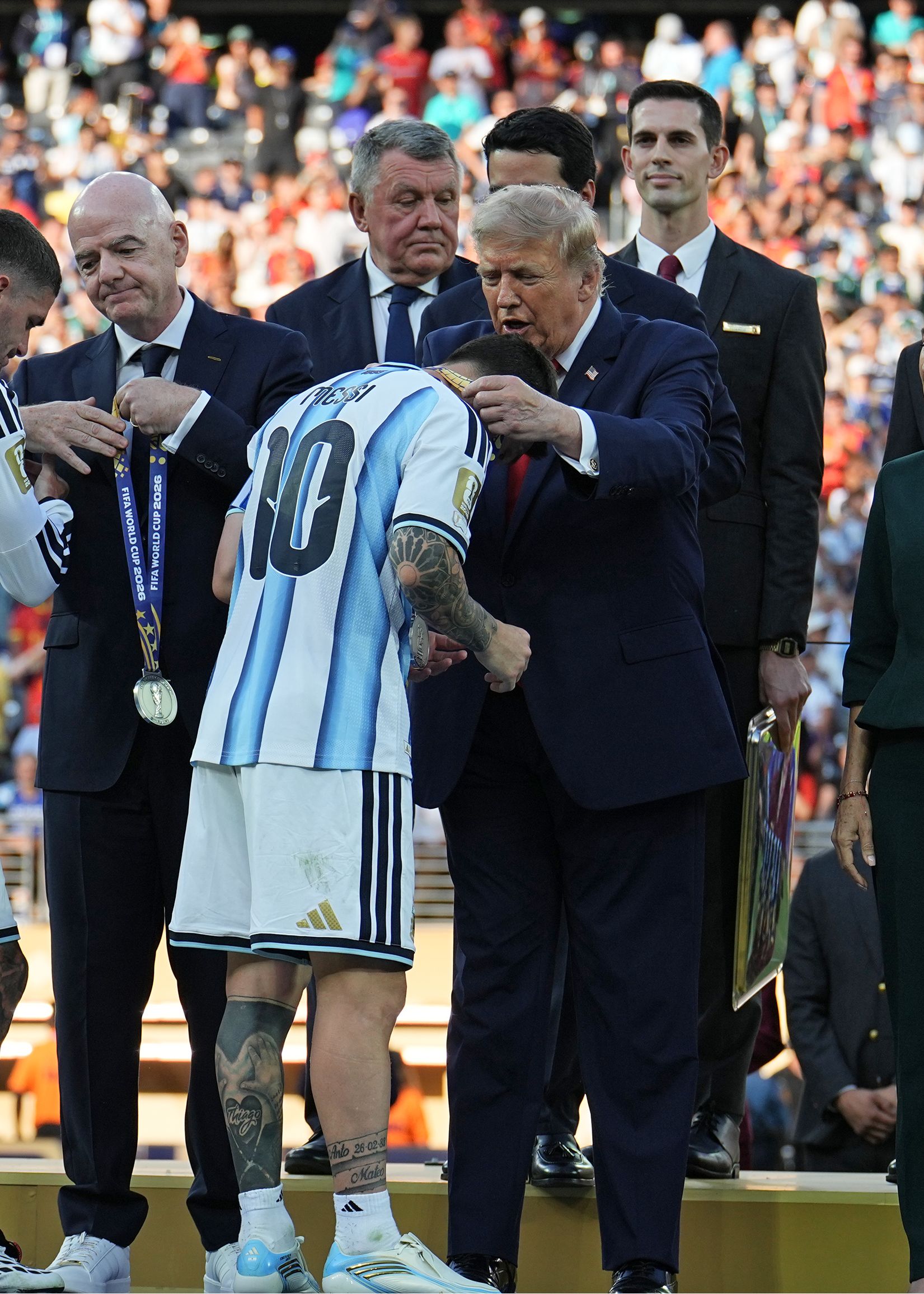 President Trump presents Lionel Messi of Argentina with a runner-up medal.