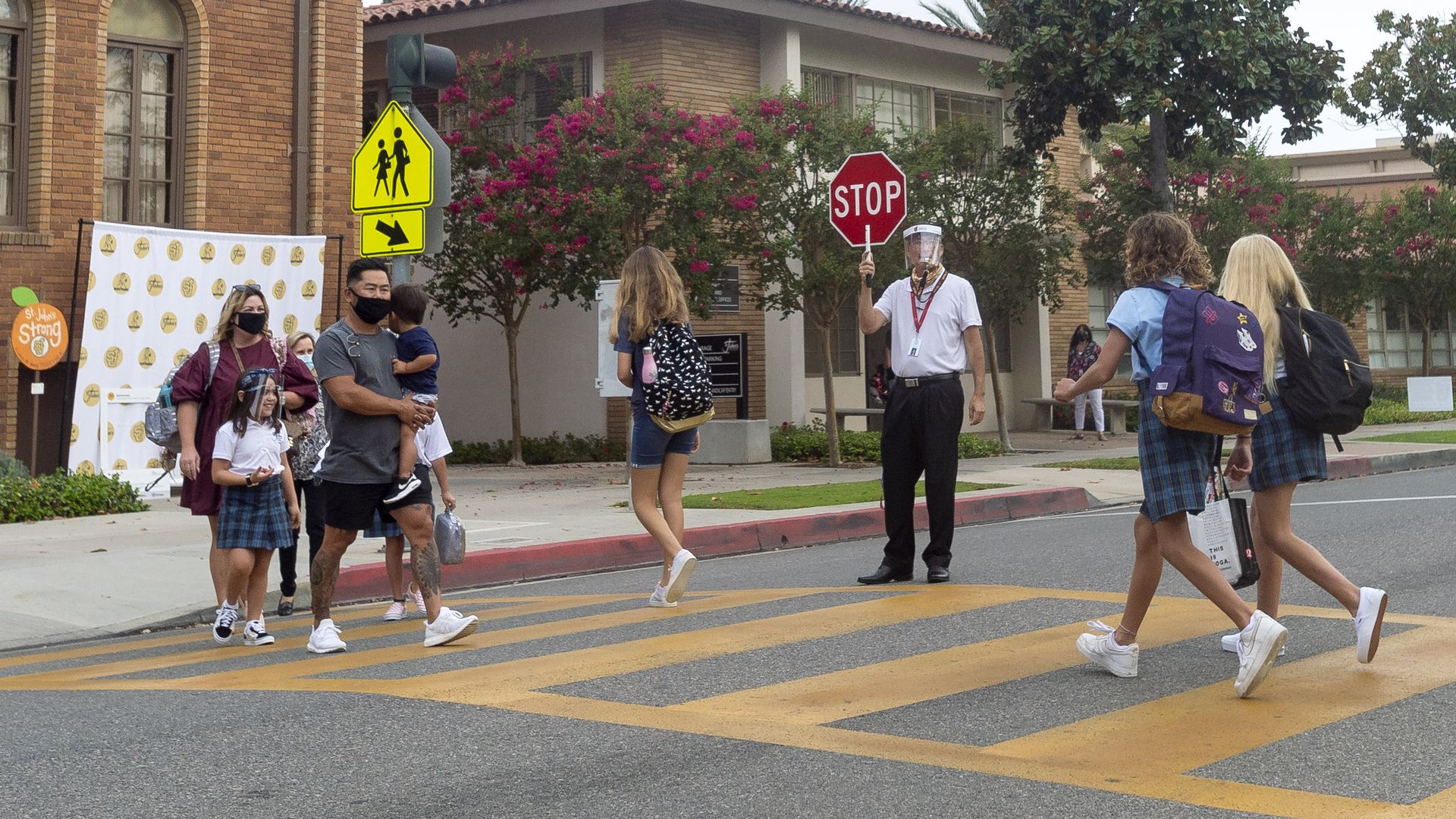Students arrive at school before the first day for in-person teaching at St. John's Lutheran School in Orange, CA on Monday, August 24