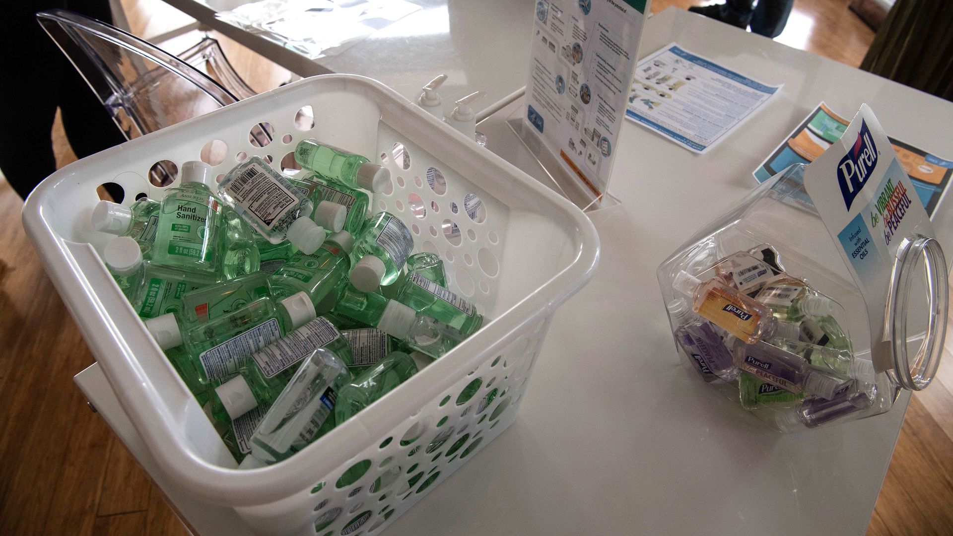 In this image, a plastic container of hand sanitizer is seen.