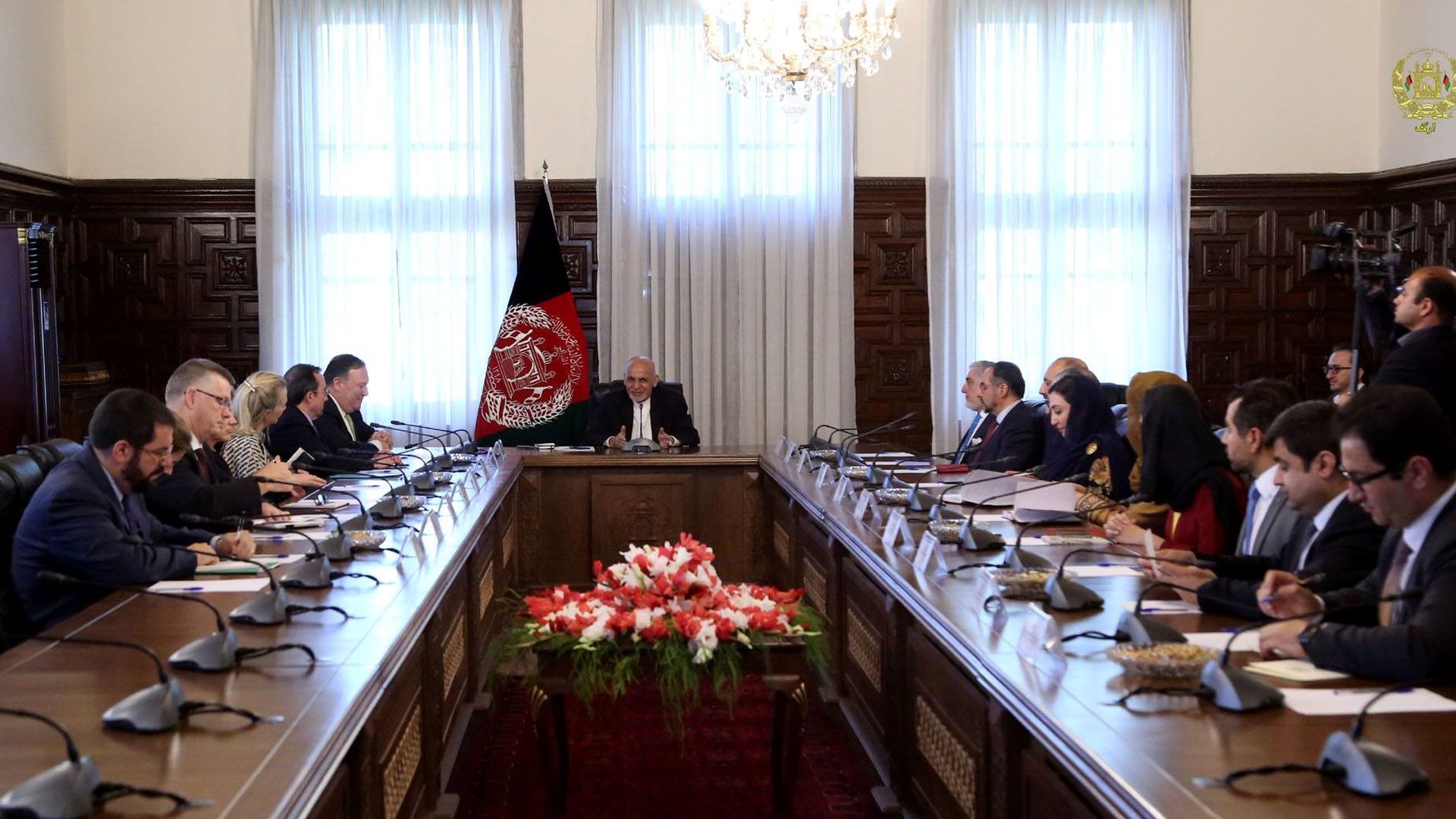 A large table with U.S. and Afghanistan representatives, with President Ashraf Ghani at the head.