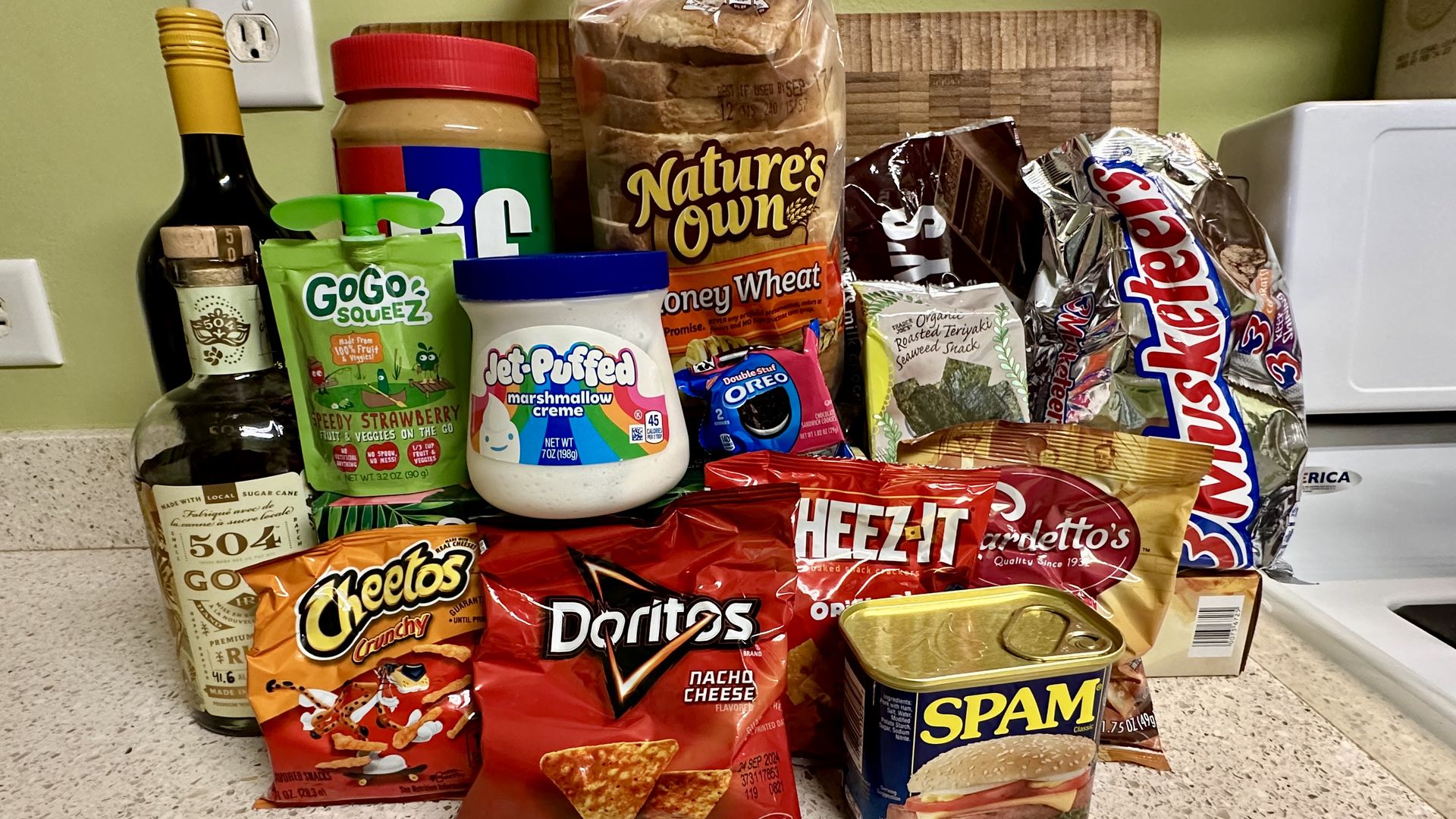 Photos shows wine, rum, chips, candy and other hurricane snacks.