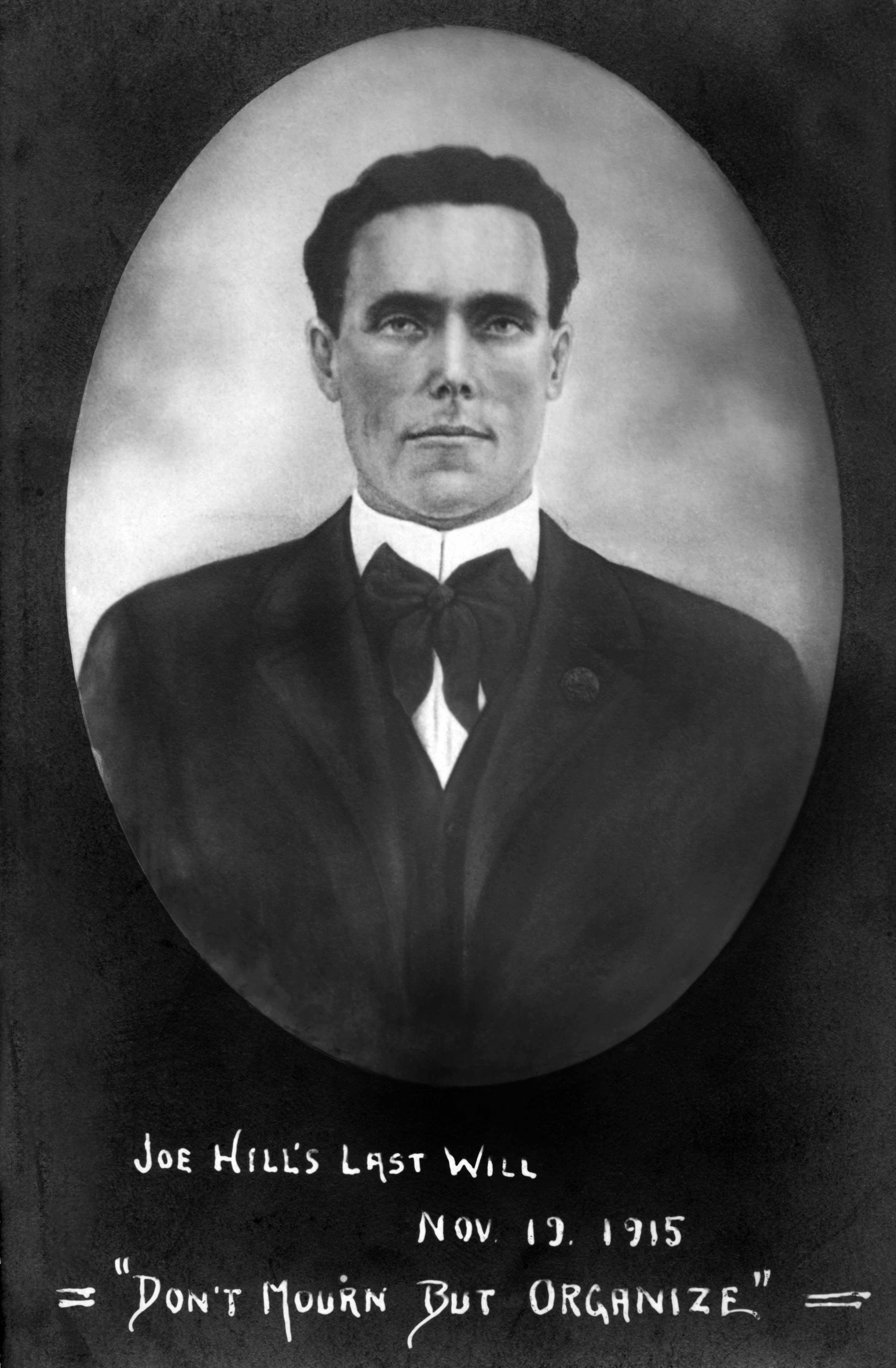 An oval, black-and-white photo of Joe Hill is inscribed with the words: "Joe Hill's last will, Nov. 19, 1915" and "Don't mourn but organize"