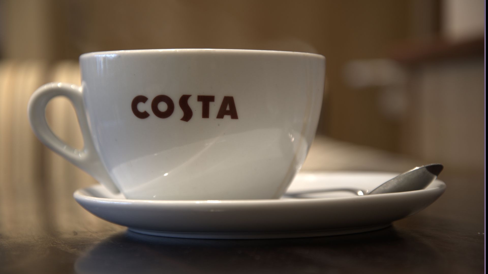 A Costa coffee cup.