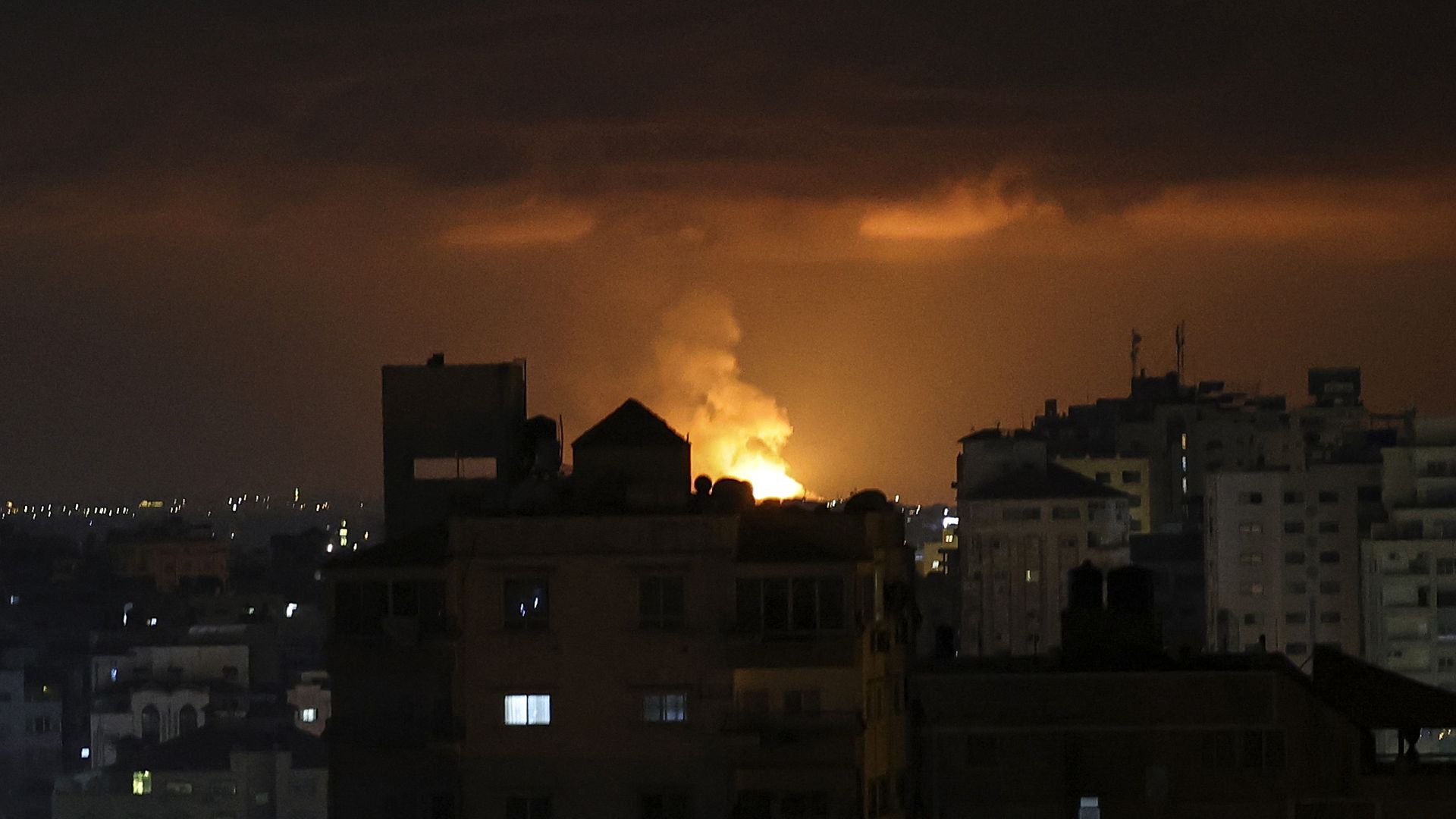 Smoke and flames rise above buildings after an Israeli airstrike in Gaza City, Palestinian Territories on May 9.